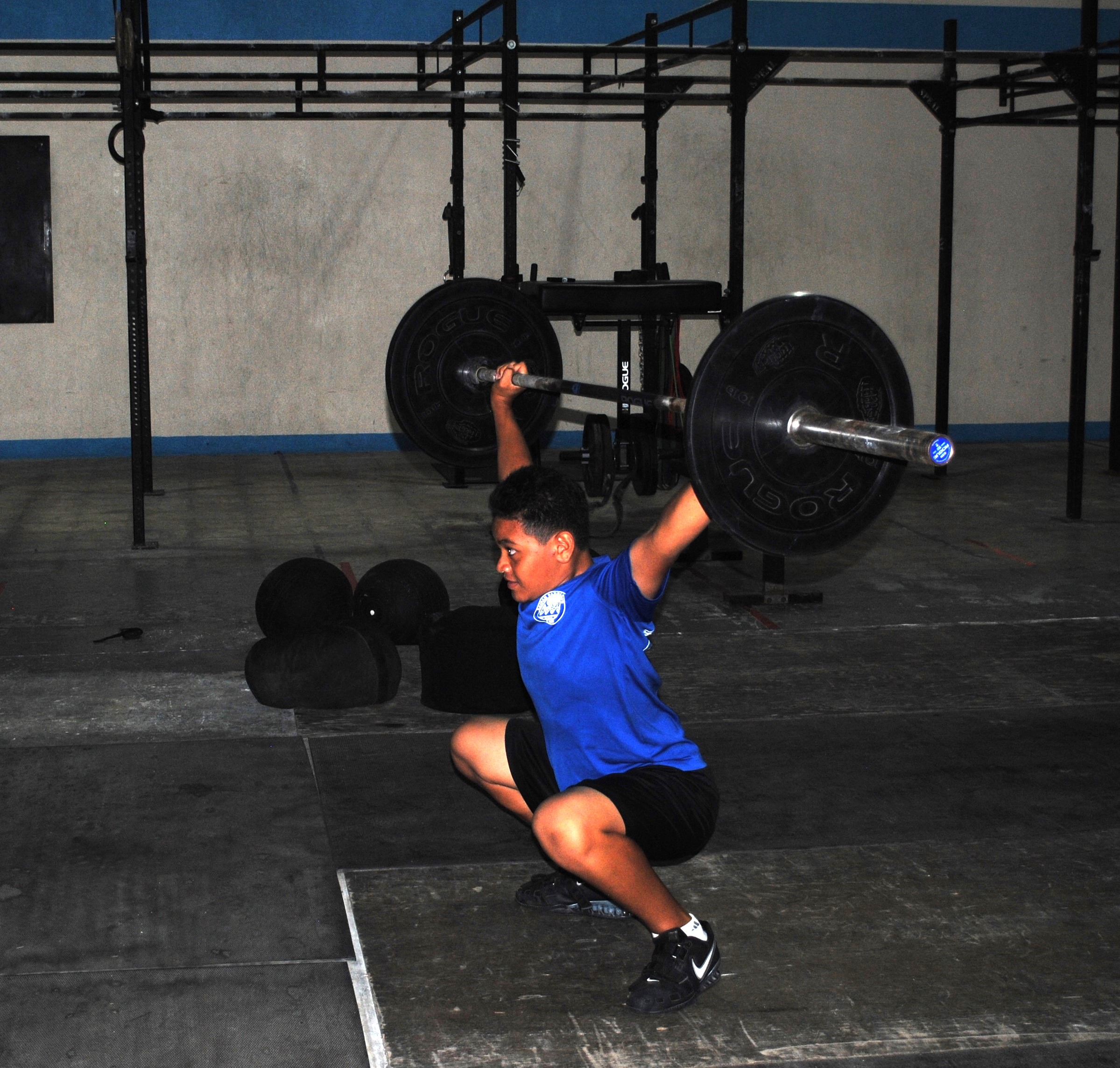 Jaden Andrew practices his snatch during a training session at the GetFitCNMI gym. 