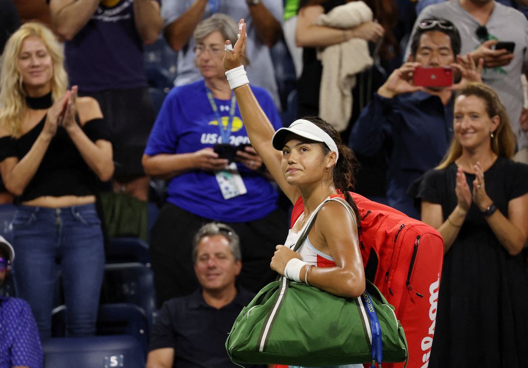 Britain's Emma Raducanu acknowledges the crowd after losing her first round match against France's Alize Cornet  in the U.S. Open at Flushing Meadows, New York, Aug. 30, 2022.