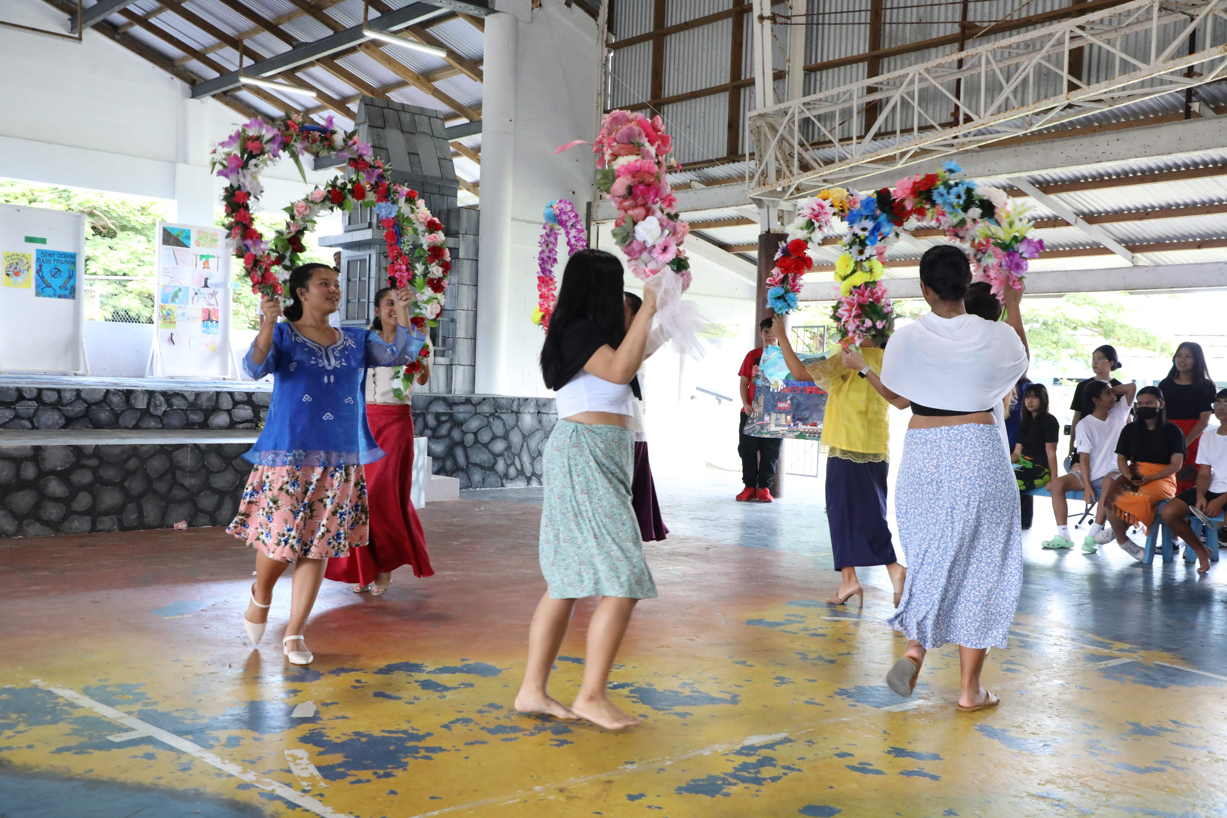 Mount Carmel School's eleventh-grade students represent the Philippines during the school's Cultural Day celebration.