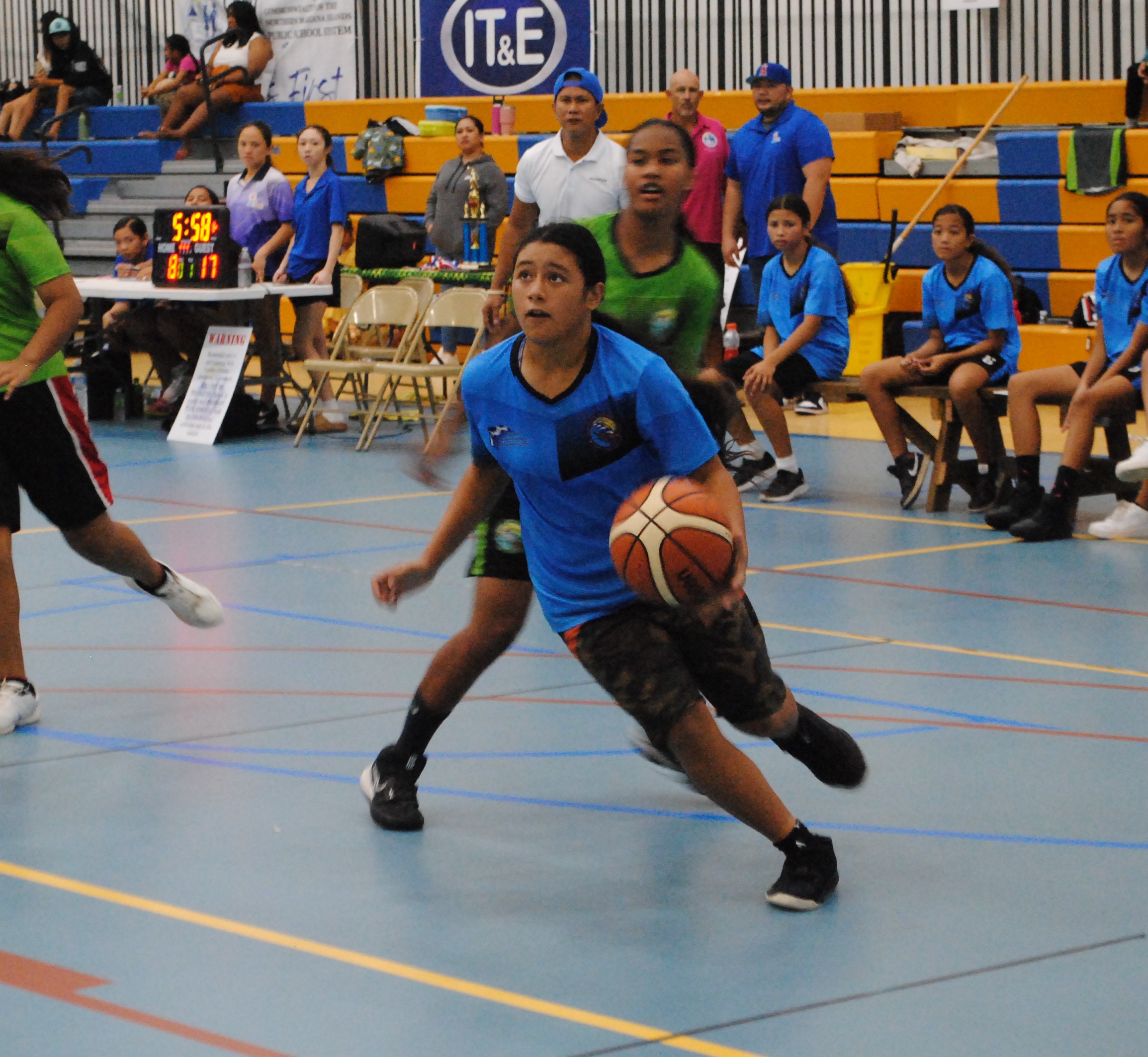 FMS' Rosie Saralu looks up as she gathers for the shot during the girls middle school championship match against DMS in the IT&E Interscholastic Basketball League Saturday at the MHS gym.