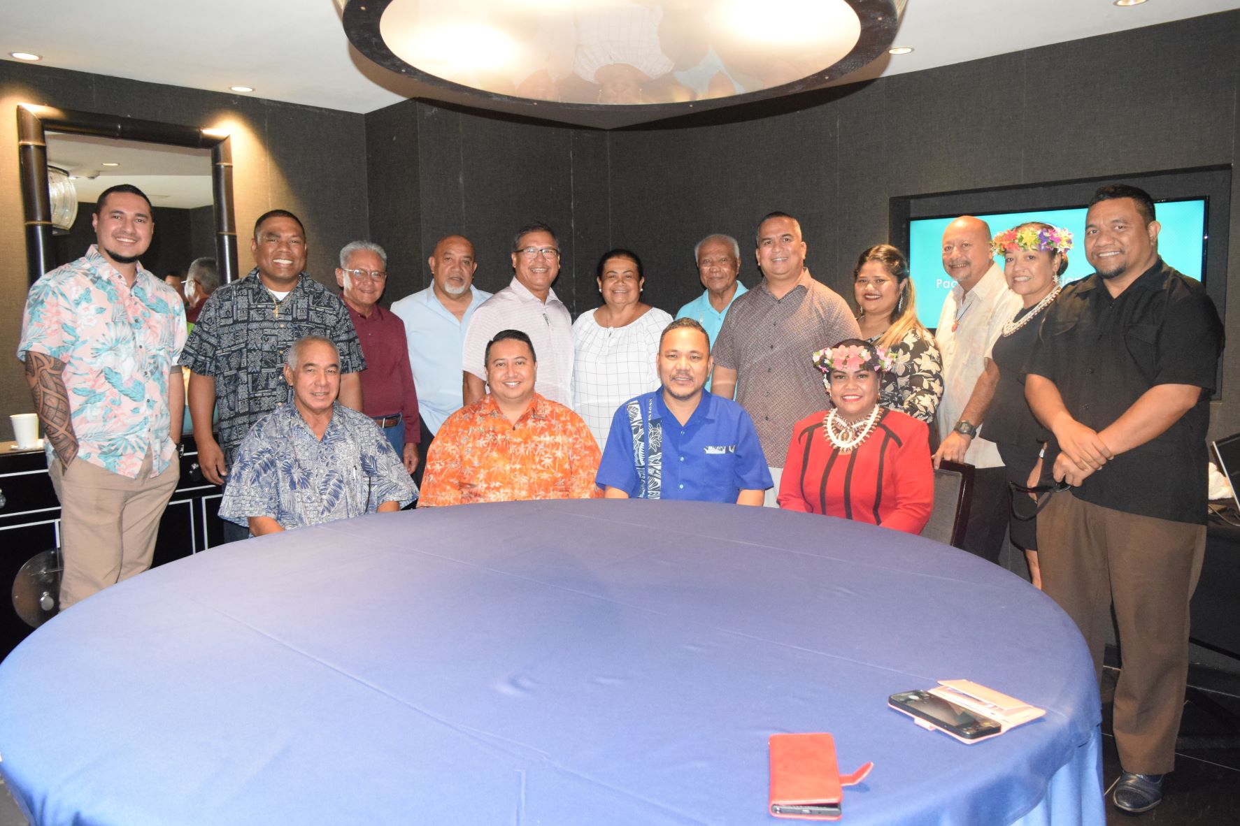 Gov. Ralph DLG Torres, second left seated, and Pacific Islands Development Bank board of governors chair, Republic of Marshall Islands Speaker Kenneth Kedi, second right seated, with RMI Finance Minister Brenson Wase, left seated, and PIDB President and CEO Lindsay Timarong, right, seated, pose for a photo during the PIDB board meeting at Kensington. Also in the picture are, from left, PIDB loan officer Jamie Aingimea, Kwajalein Atoll Development Authority Executive Director Anjojo Kabua, former Bank of Guam chief financial officer Frank Atalig,  U.S. Army veteran Robson Henry, former CNMI Lt Gov. Diego Benavente, Pohnpei Treasury and Administration Director Christina Elnei, Palau Former Finance Minister Elbuchel Sadang, RMI Sen. David Paul, PIDB loan service specialist Rachel Gabiriel, CNMI Department of Community and Cultural Affairs Joseph P. Deleon Guerrero, PIDB manager of administration Rosa Weilbacher and RMI Nijitela assistant clerk Carl Alik.
