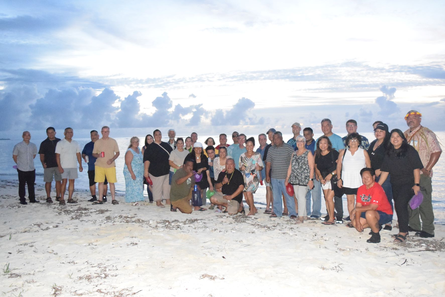 The Commonwealth Ports Authority officials and members of  the Association of Pacific Ports pose for a group photo at Laly 4 Beach on Sept. 27, 2022.