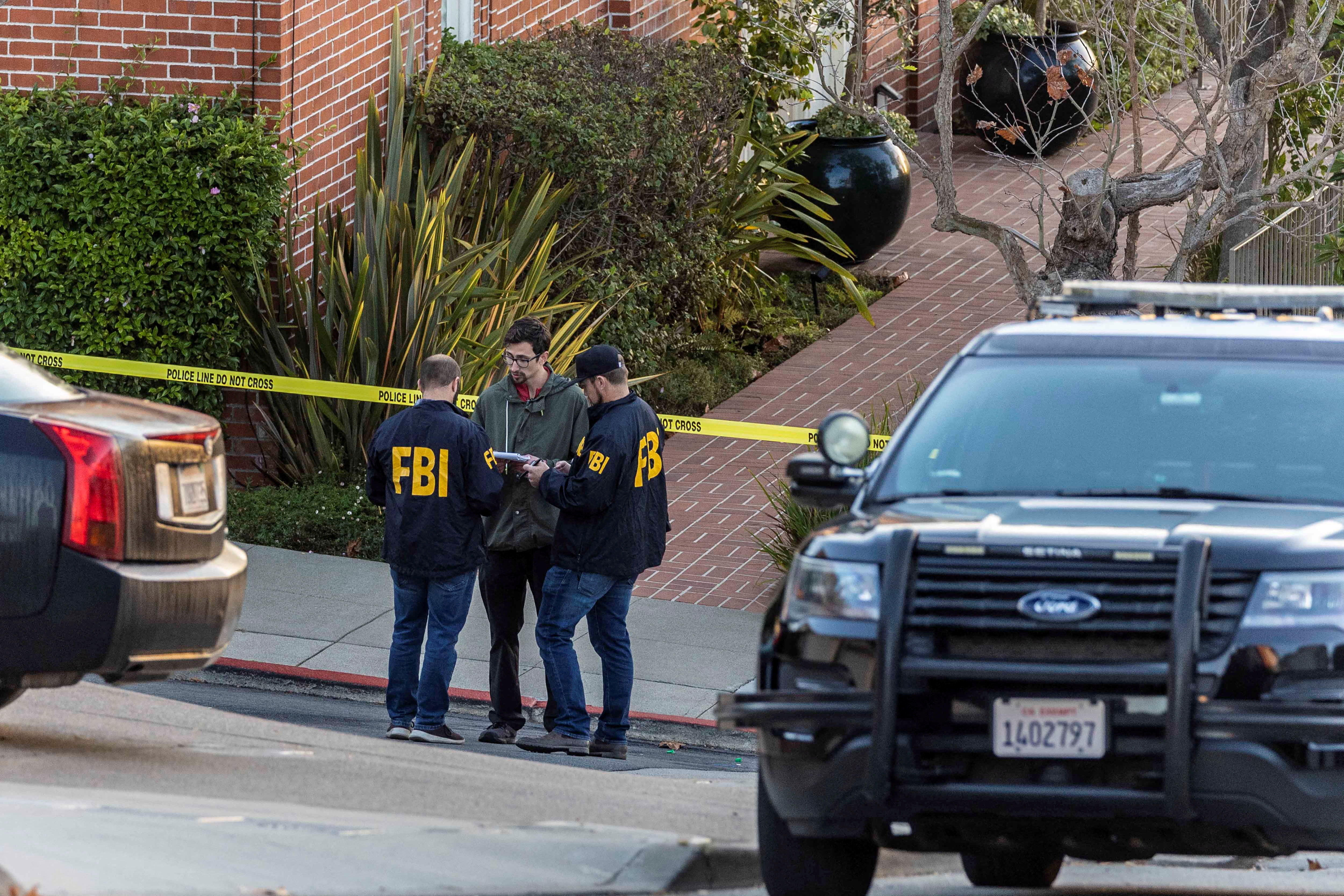 FBI agents work outside the home of U.S. House Speaker Nancy Pelosi where her husband Paul Pelosi was violently assaulted after a break-in at their house, according to a statement from her office, in San Francisco, California, Oct. 28, 2022.