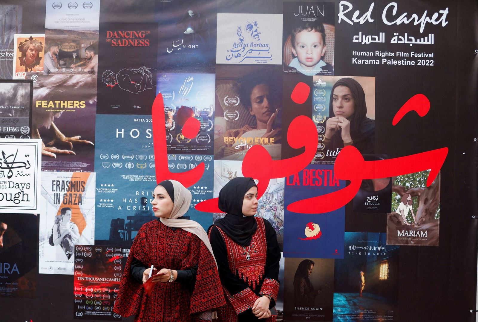 Palestinian volunteers participate in organizing the sixth edition of the Red Carpet Film Festival, at a newly renovated theatre in Gaza City, Oct. 13, 2022.