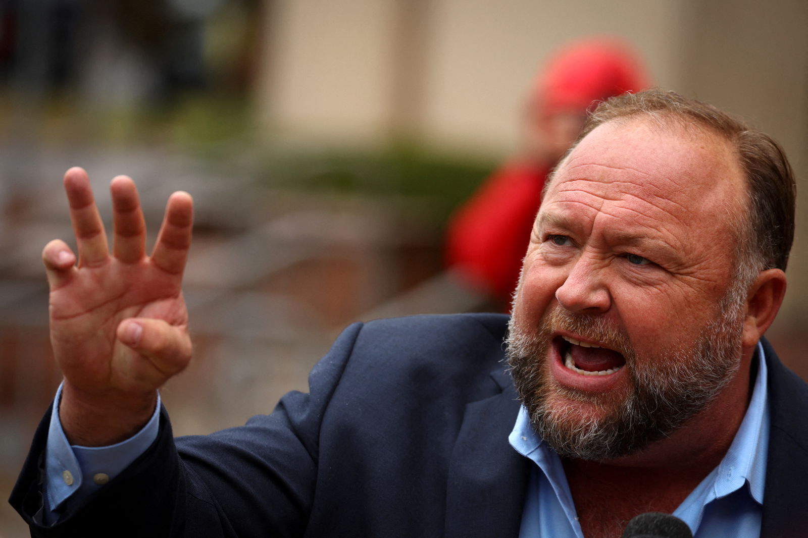 Infowars founder Alex Jones speaks to the media after appearing at his Sandy Hook defamation trial at Connecticut Superior Court in Waterbury, Connecticut, Oct. 4, 2022.