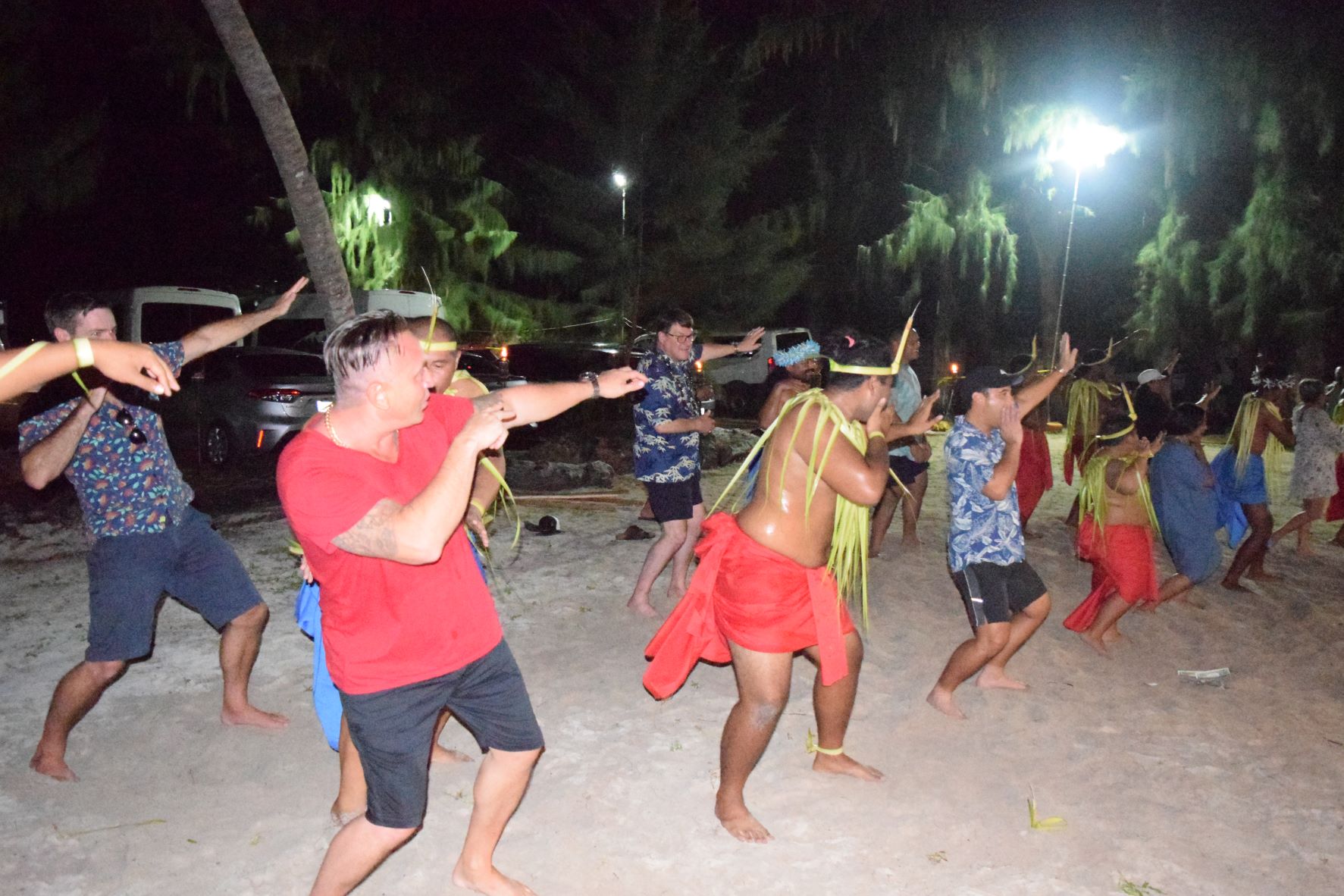 Association of Pacific Ports members join a Carolinian cultural dance troupe at Laly 4 Beach on Sept. 27, 2022.