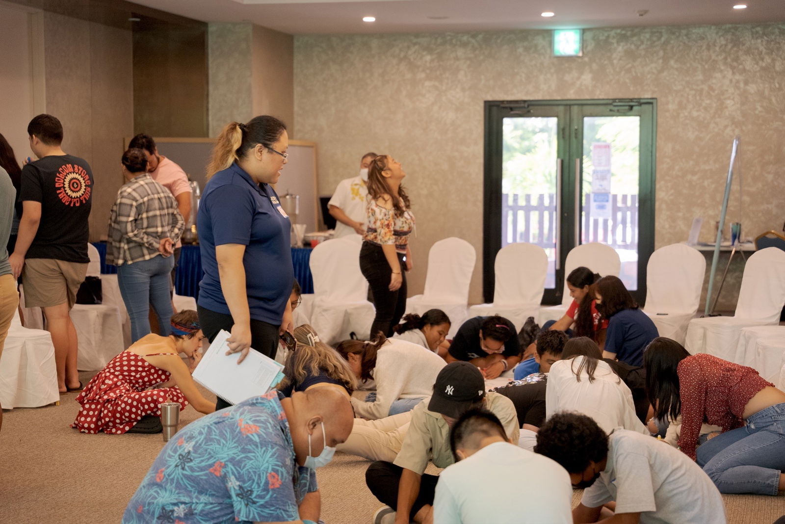 Marianas High School Counselor Kelly Demapan with the SOS Training Team leads an illustration activity with MH’ peer leaders and adult advisors.