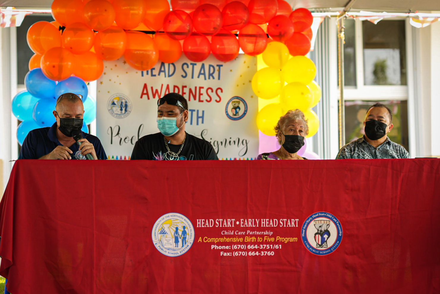 BOE Chairman Gregory Pat Borja, left, signs the proclamation as Head Start Policy Council Chairman Jacob Lizama, Tinian’s first Head Start Center Director Magdalena Manglona Hofschneider and Commissioner of Education Alfred Ada looks on.