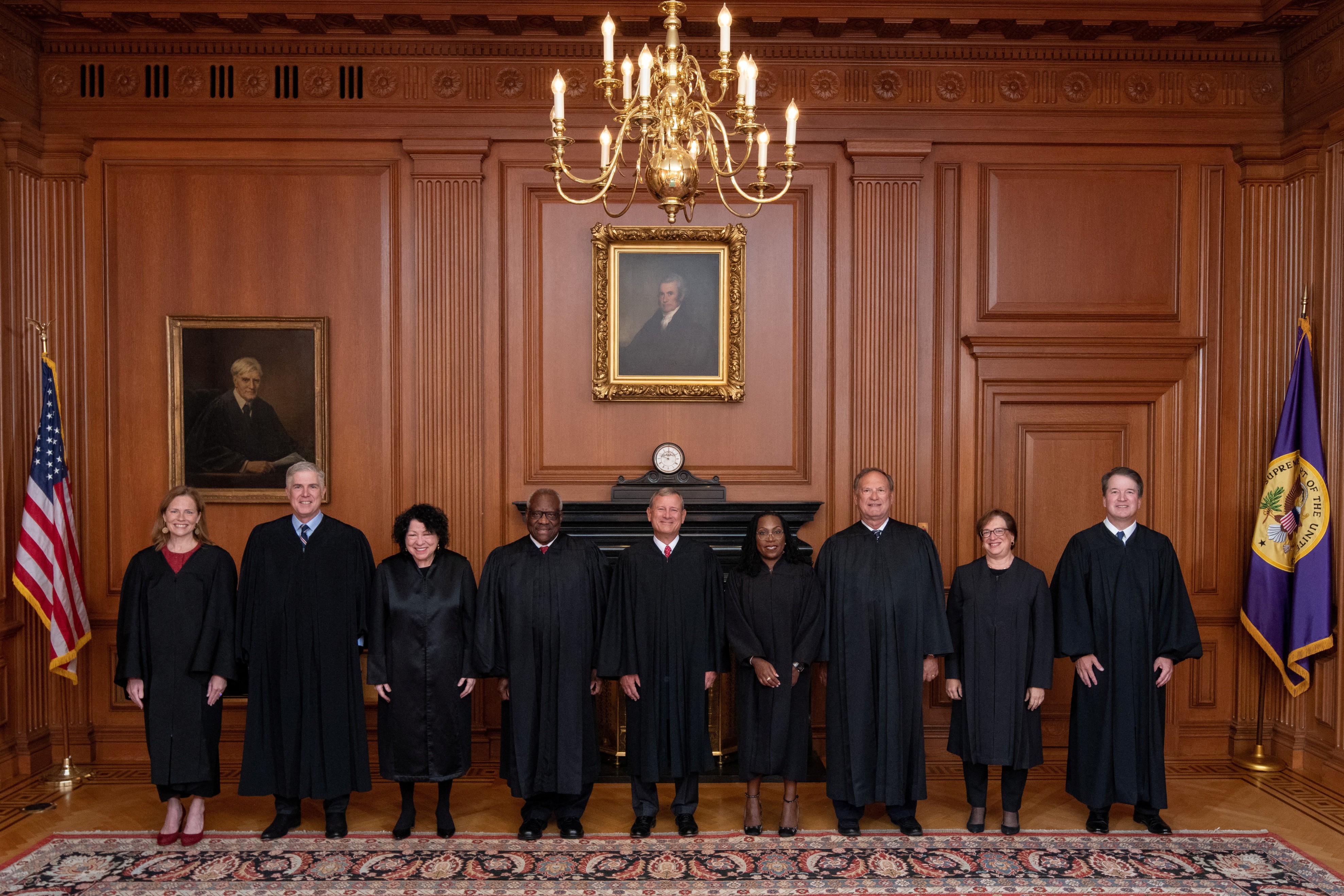 U.S. Supreme Court Chief Justice John Roberts and Associate Justice Ketanji Brown Jackson are flanked by fellow justices as they pose prior to Justice Jackson's investiture ceremony at the Supreme Court in Washington, D.C., Sept. 30, 2022. From left, Associate Justices Amy Coney Barrett, Neil Gorsuch, Sonia Sotomayor and Clarence Thomas, Chief Justice Roberts and Associate Justices Justices Ketanji Brown Jackson, Samuel Alito, Jr., Elena Kagan, and Brett Kavanaugh.
