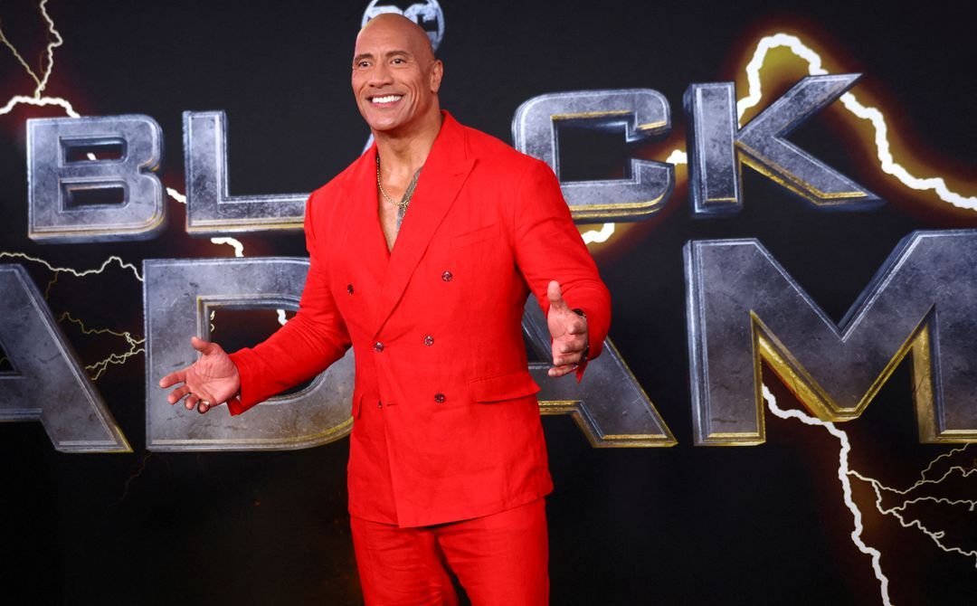 Actor Dwayne Johnson poses for photographers as he arrives for the world premiere of the film “Black Adam” in Times Square in New York City, Oct. 12, 2022.