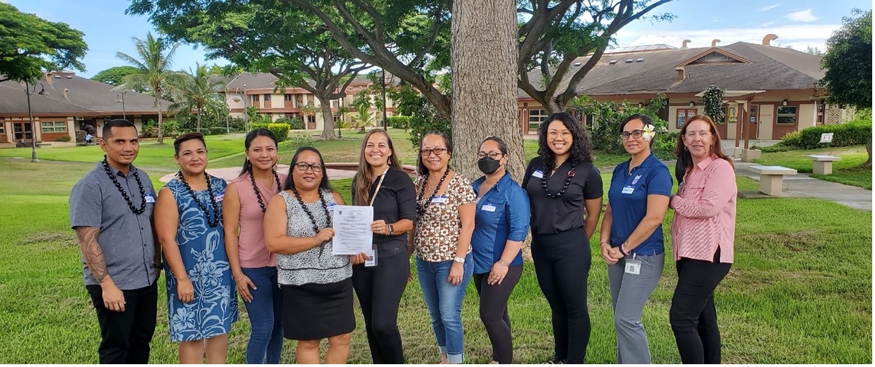 CNMI  Workforce Investment Agency Director Frances Torres receives a copy of the memorandum of understanding from Hawai’i Job Corps Director Ellen May.