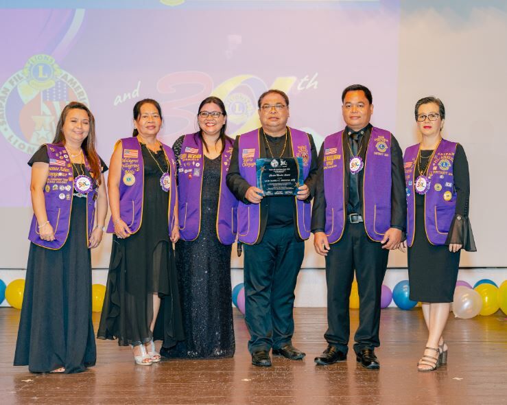 Mario Mayuga was presented with the Charter Member Award by the Saipan Fil-American Lions Club.