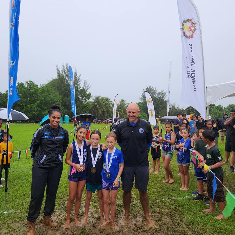 Lovell Spaeth, Scarlett Burrell and Leilani Ruszala are the top three finishers in the elementary school U9 category of the NMA-PSS All School Cross Country Championships at the Saipan Vegas Country Club on Saturday.