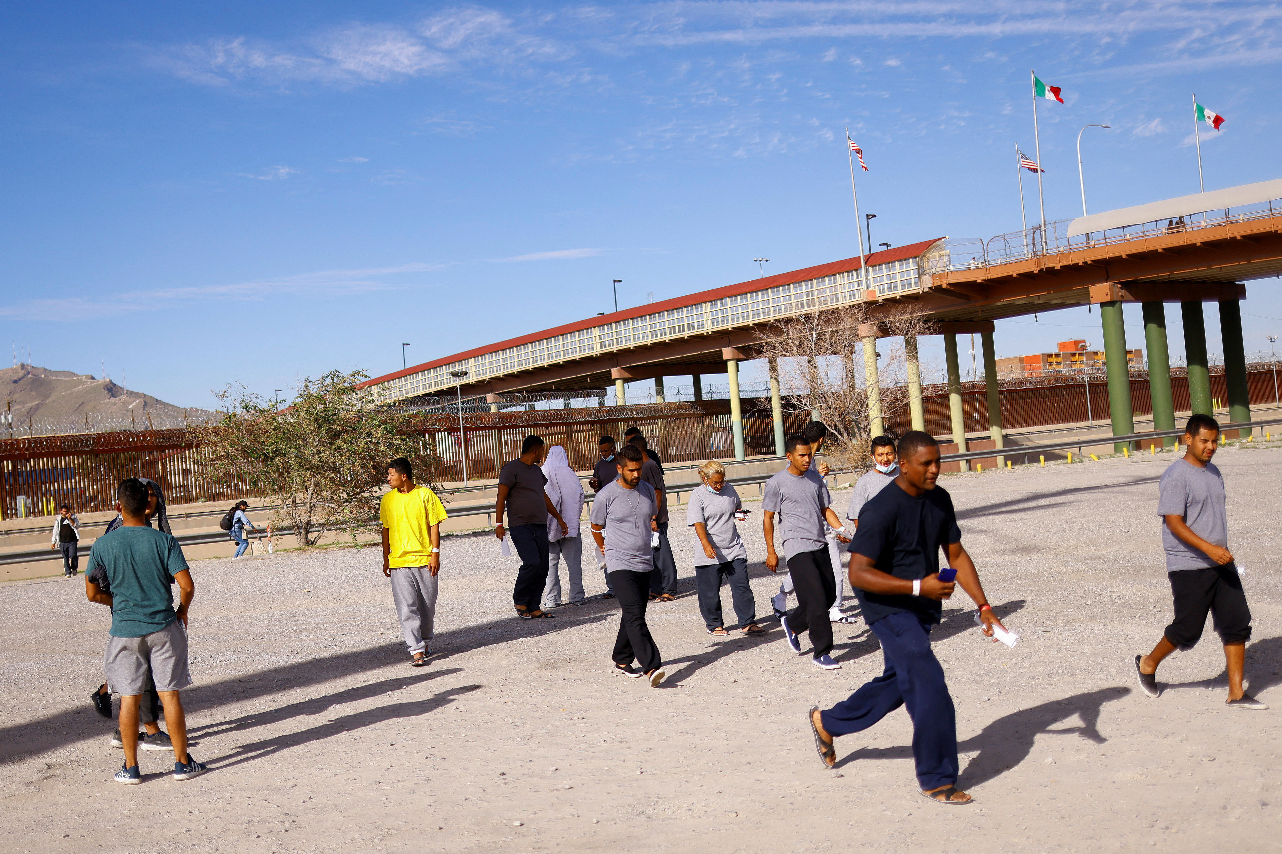 Venezuelan migrants, expelled from the U.S. and sent back to Mexico under Title 42, walk near the Lerdo Stanton International border bridge, in Ciudad Juarez, Mexico, Oct. 13, 2022.