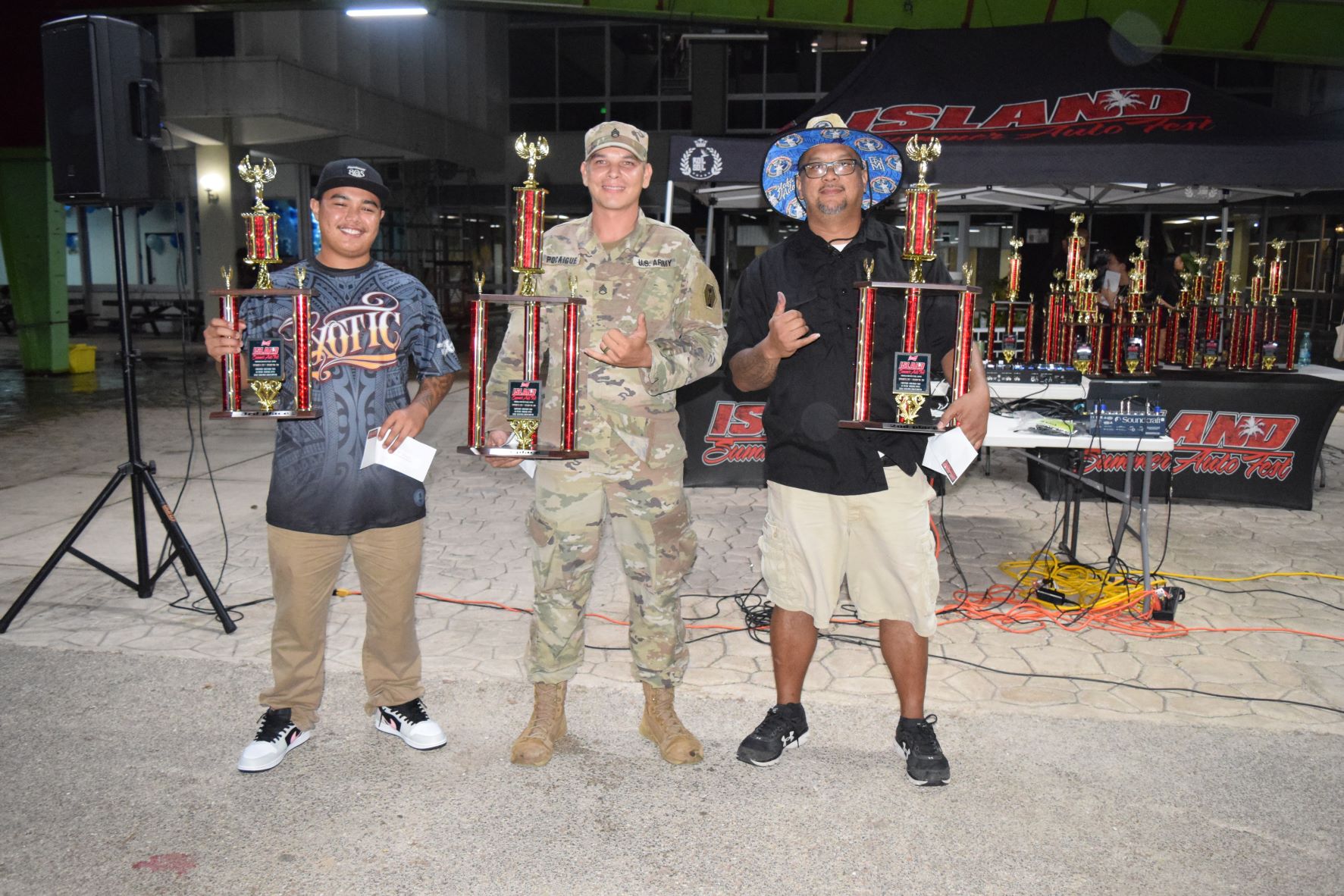 Cruiser bike category first place winner Juan Pocaigue, center; second placer Mark Borja, right; and third placer Nathaniel Torres, left.