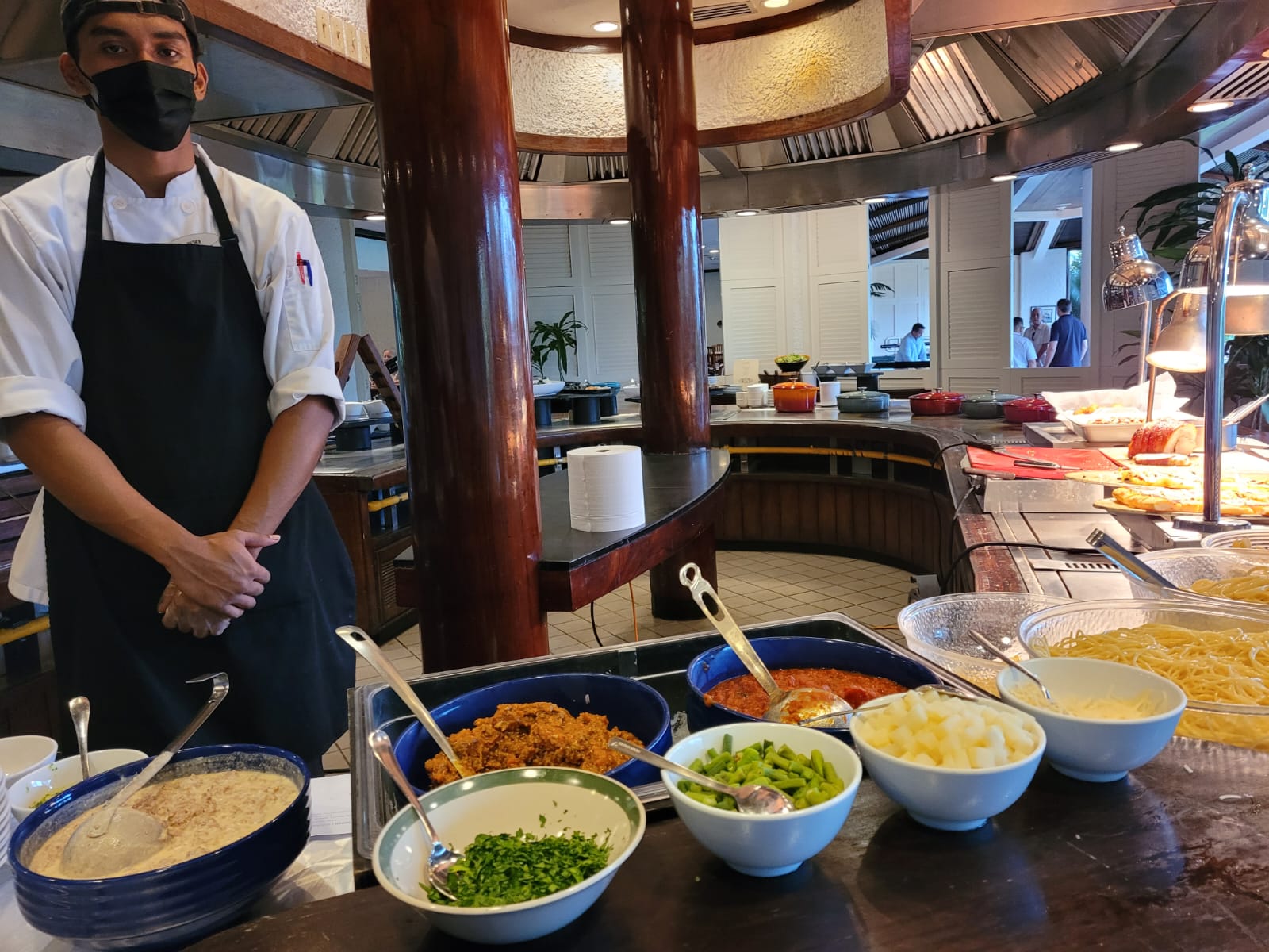 Giovanni's Cook 1 Matthew Tateus Igisaiar stands next to the pasta section of the lunch buffet.