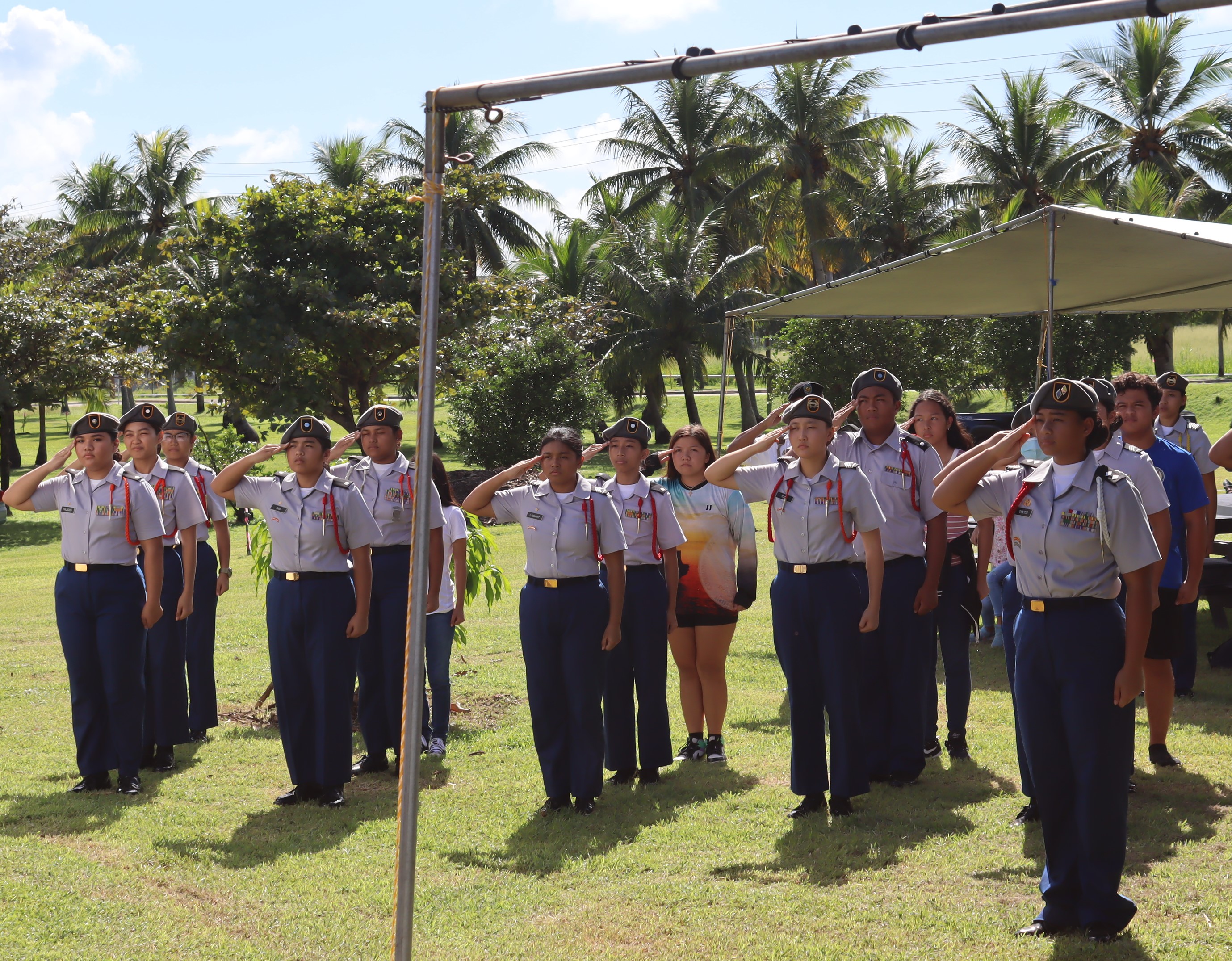 Stallion Battalion cadets present arms for the posting of colors.