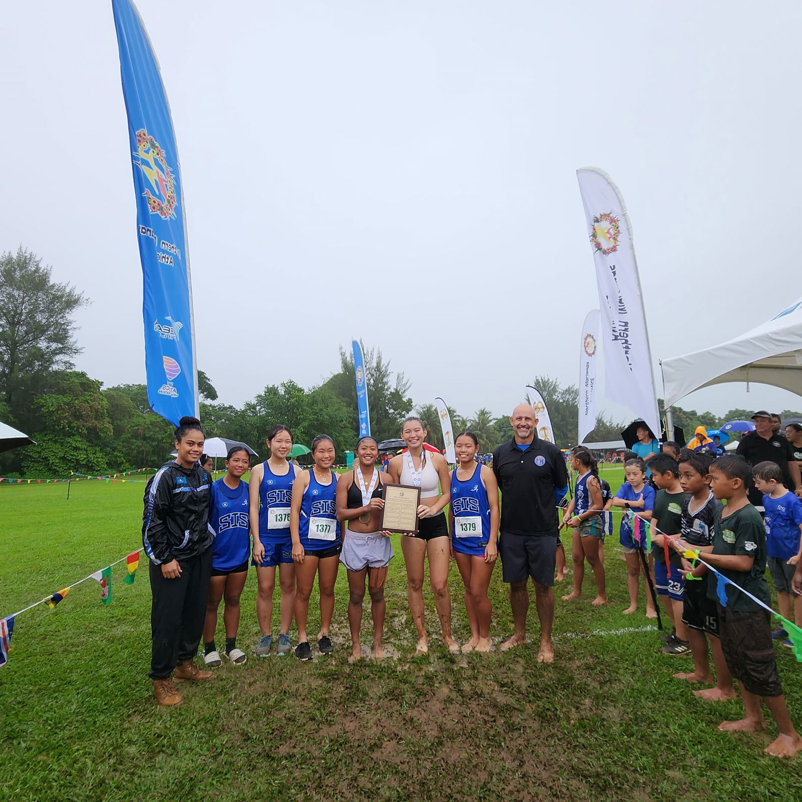 The Saipan International School girls pose with their first-place trophy in the NMA-PSS Cross Country championships Saturday at the Saipan Vegas Country Club.
