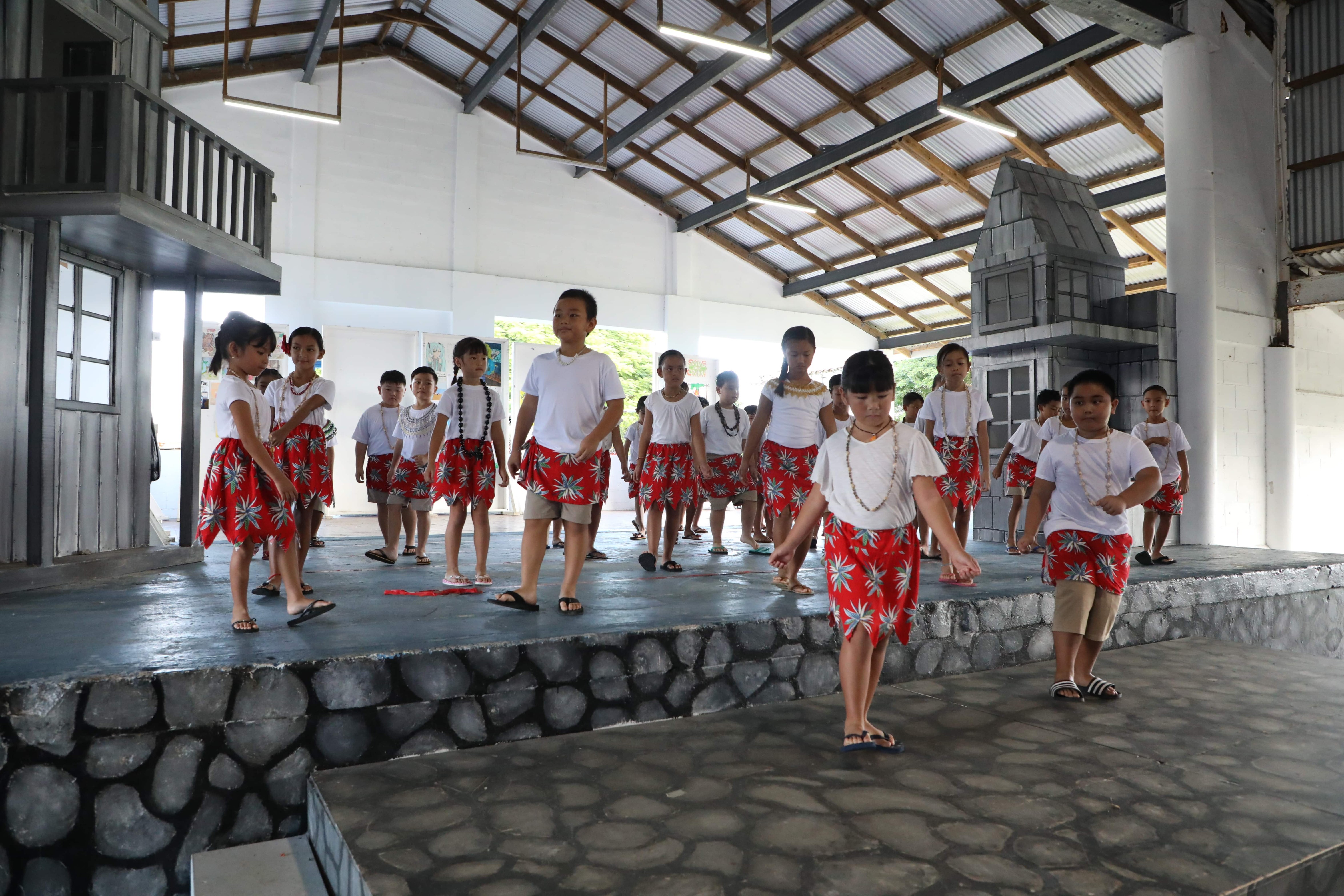 Mount Carmel School's second-grade students represent the Federated States of Micronesia during the school's Cultural Day celebration.