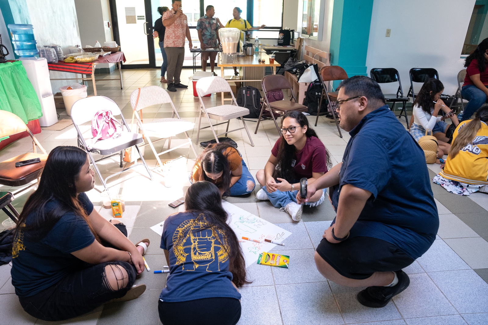 Frank Lee Borja, community project manager- Local Education Agency Tinian, leads an SOS wellness model and group activity with Tinian Jr.-Sr. and Dr. Rita Hocog Inos High School peer leaders.