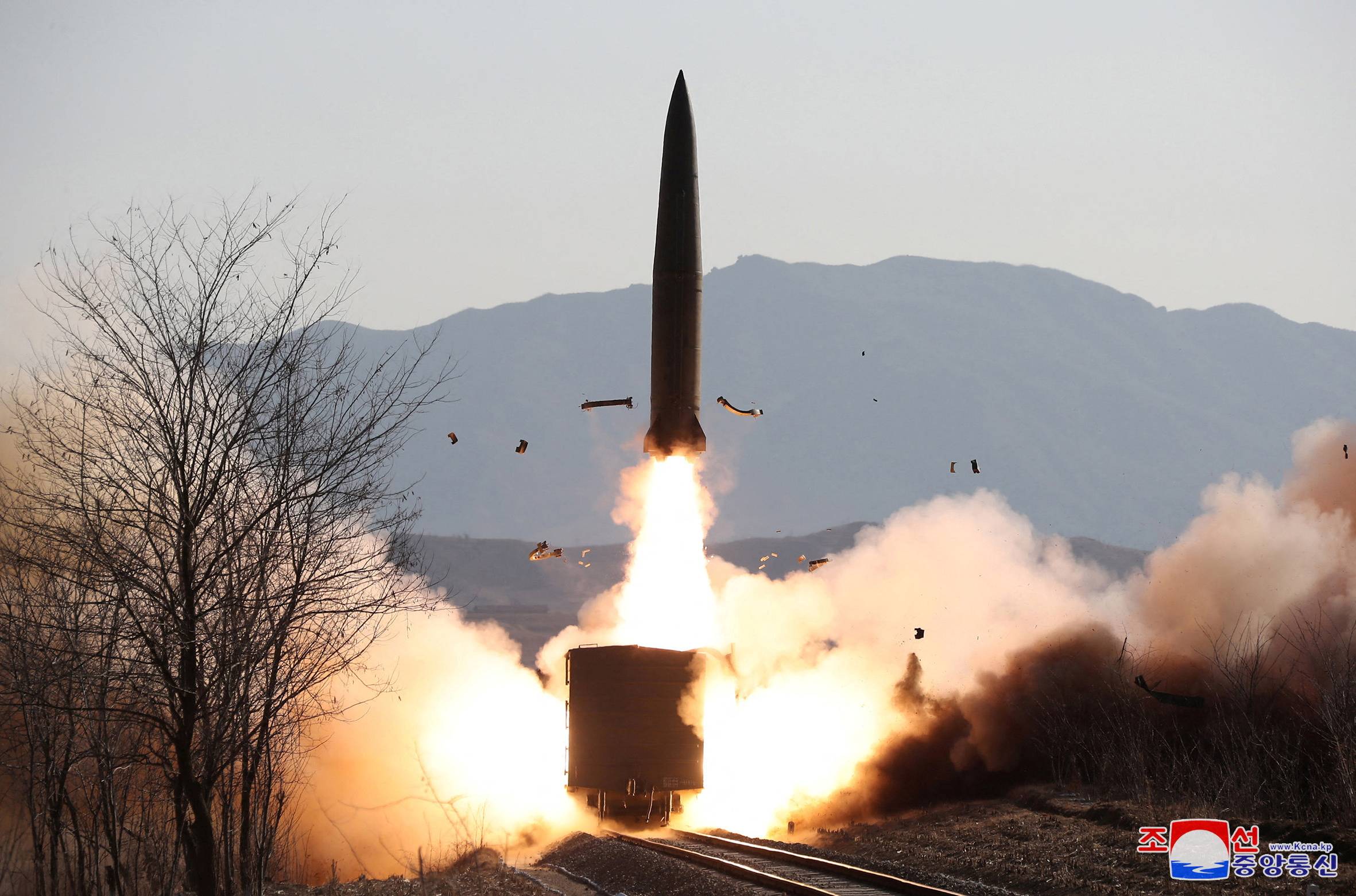 A railway-born missile is launched during firing drills, according to state media, at an undisclosed location in North Korea, in this photo released Jan. 14, 2022 by North Korea's Korean Central News Agency. 