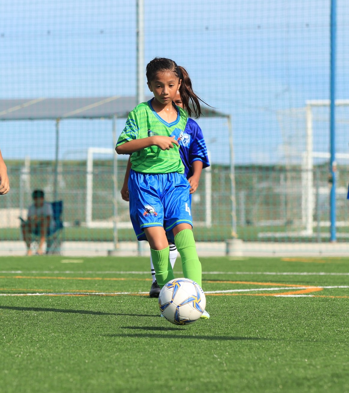 WSR 2's Darshwana Chhetri dribbles past a defender during an elementary school division game of the NMIFA-PSS Interscholastic Soccer League at the NMI Soccer Training Center in Koblerville.