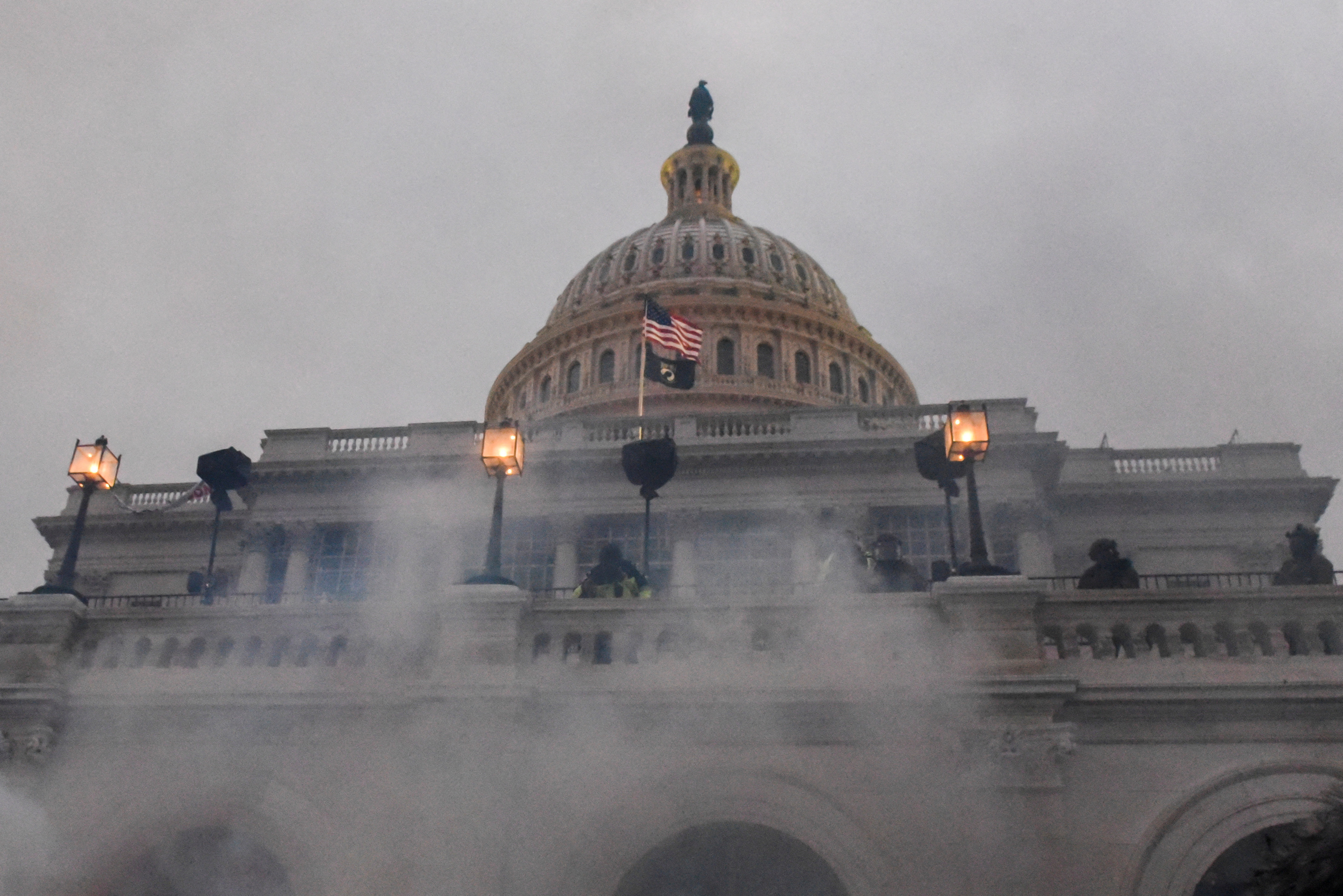 Police clear the U.S. Capitol with tear gas as supporters of then-President Donald Trump gather outside, in Washington, D.C., Jan. 6, 2021.