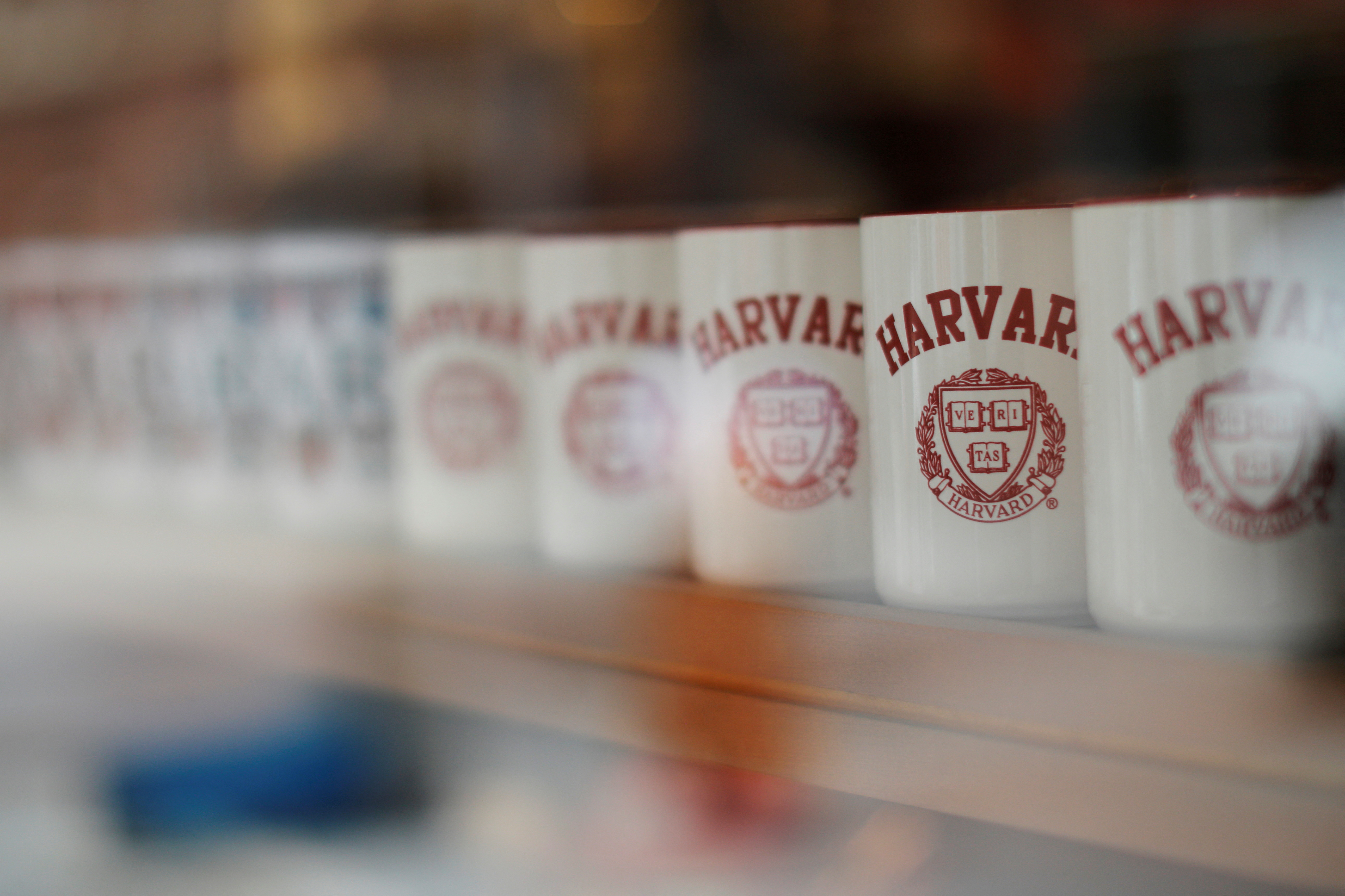Mugs bearing the school's logo are displayed for sale outside Harvard University in Cambridge, Massachusetts, June 18, 2018.