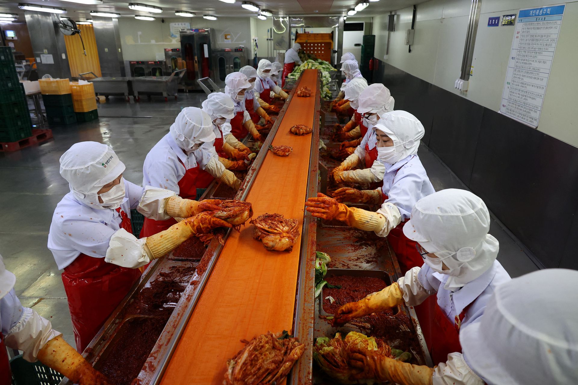 Employees work at Cheongone Organic Kimchi factory in Cheongju, South Korea, Sept. 26, 2022.