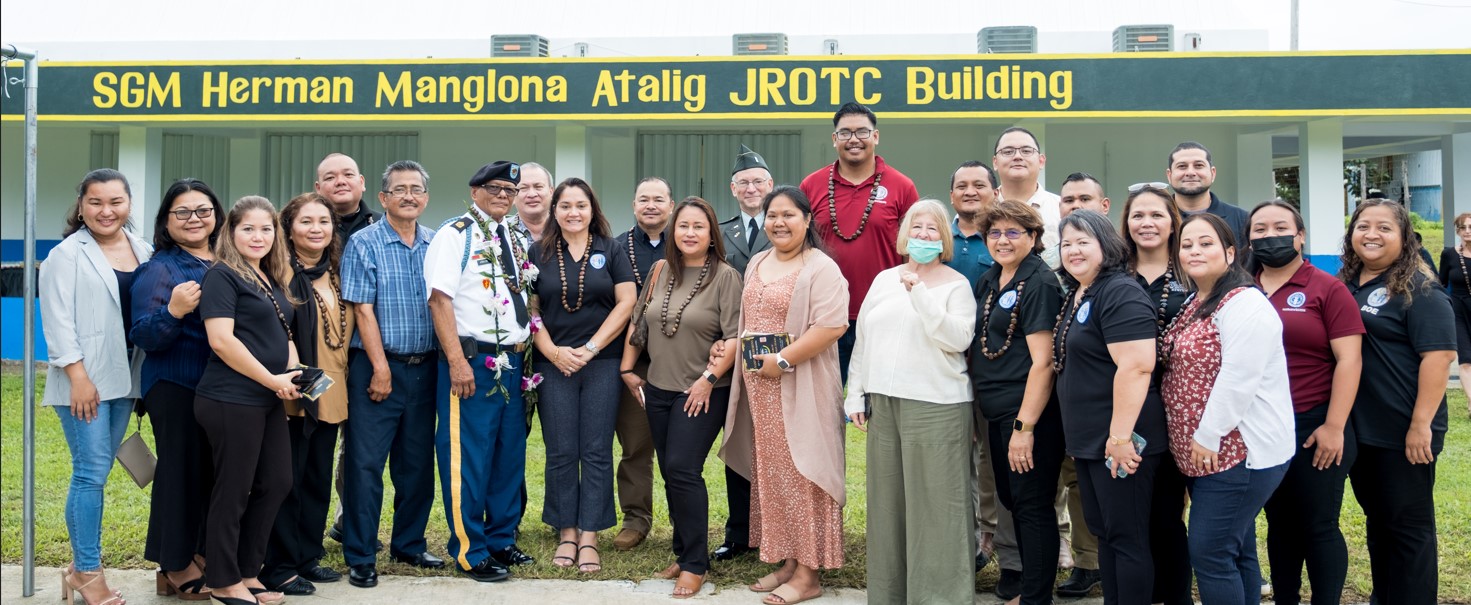 Education and Rota officials gather to celebrate the renaming of the Dr. Rita Hocog Inos Jr. Sr. High School JROTC annex building in honor of retired Sgt. Maj. Herman M. Atalig, a Board of Education member, on  Friday afternoon.  Also in photo are Commissioner of Education Dr. Alfred B. Ada, acting Board of Education Chairman Antonio L. Borja of Tinian, Saipan BOE Member Andrew L. Orsini, Teacher Representative Phyllis Ain, Non-Public School Representative Dr. Ronald Snyder, Dr. Rita H. Inos Jr. Sr. High School Principal D. Tanya King, Public School System Senior Directors Jackie Quitugua, Dr. Rizalina Liwag and Dr. Yvonne R. Pangelinan, other PSS officials, Rota Mayor Efraim Atalig, Rep. Donald Manglona, and Rota municipal officials.