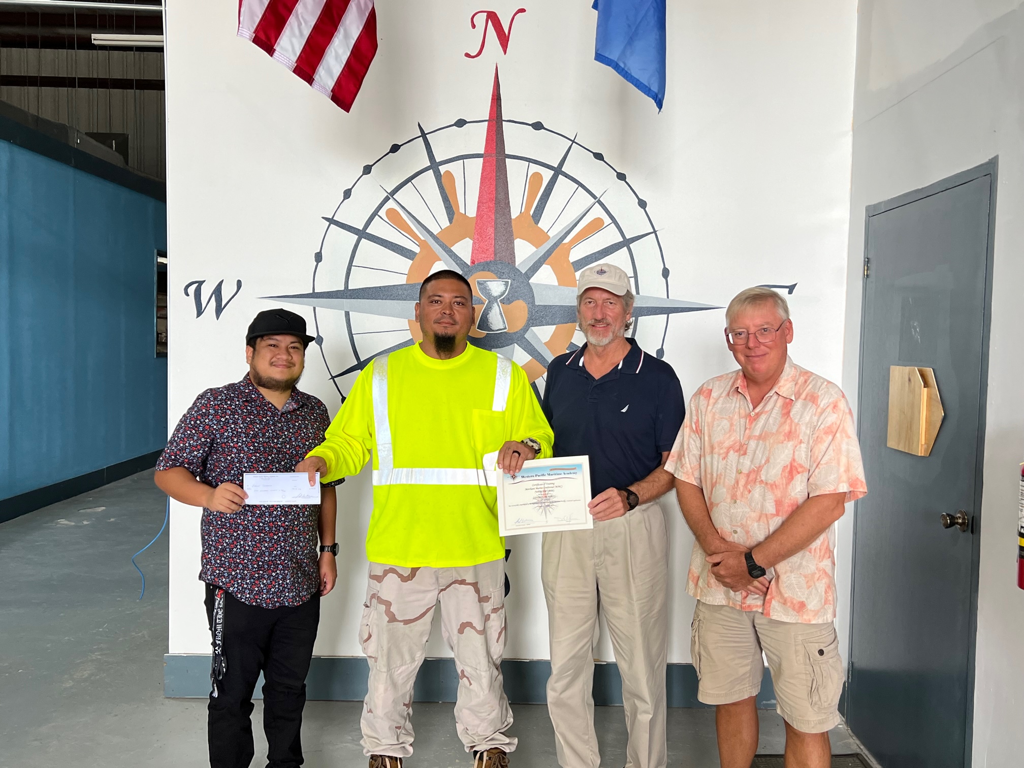 Jason Tenorio receives his ARPA-funded payment for his merchant marine credential application.