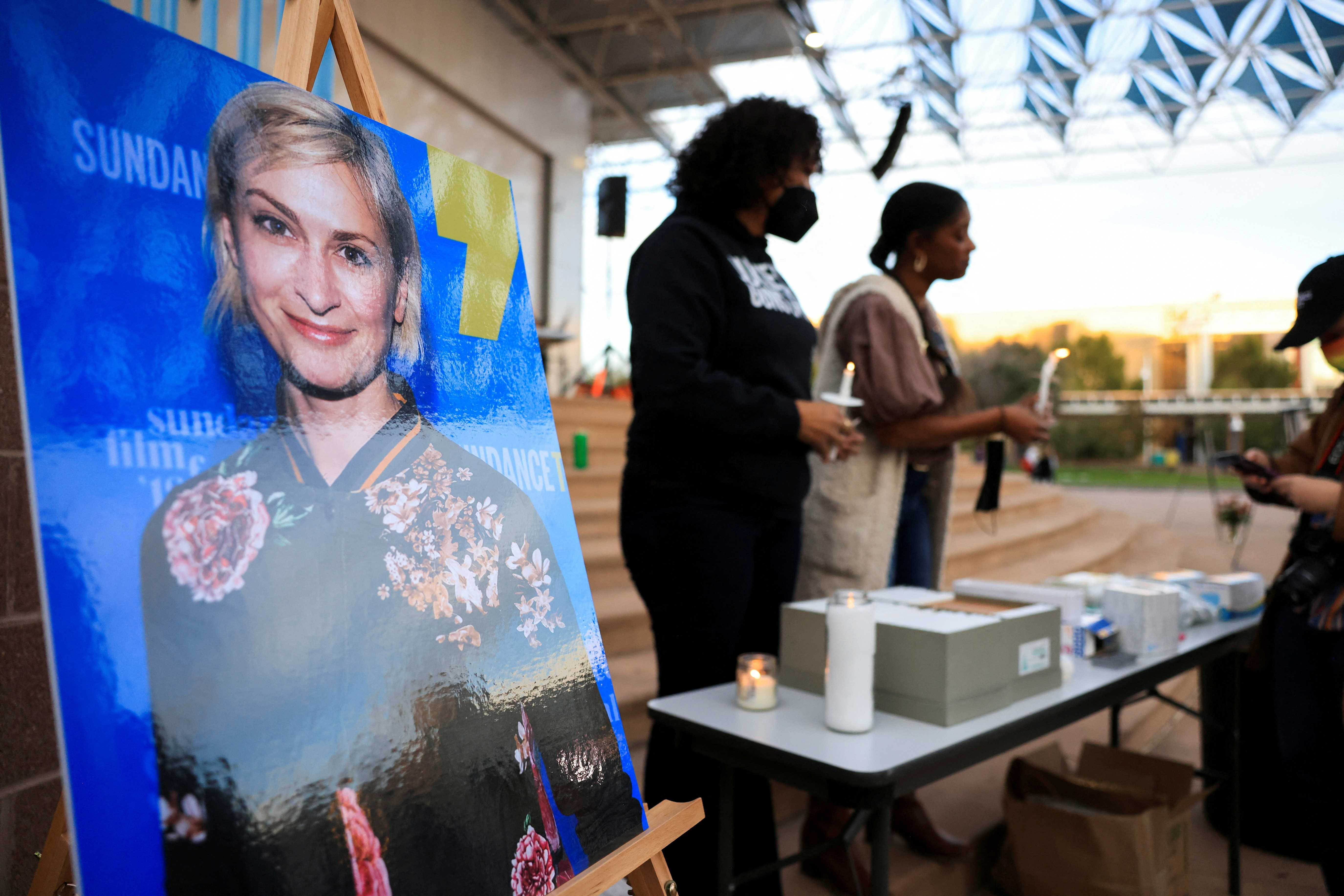 An image of cinematographer Halyna Hutchins, who died after being shot by Alec Baldwin on the set of his movie "Rust," is displayed at a vigil in her honor in Albuquerque, New Mexico, Oct. 23, 2021.