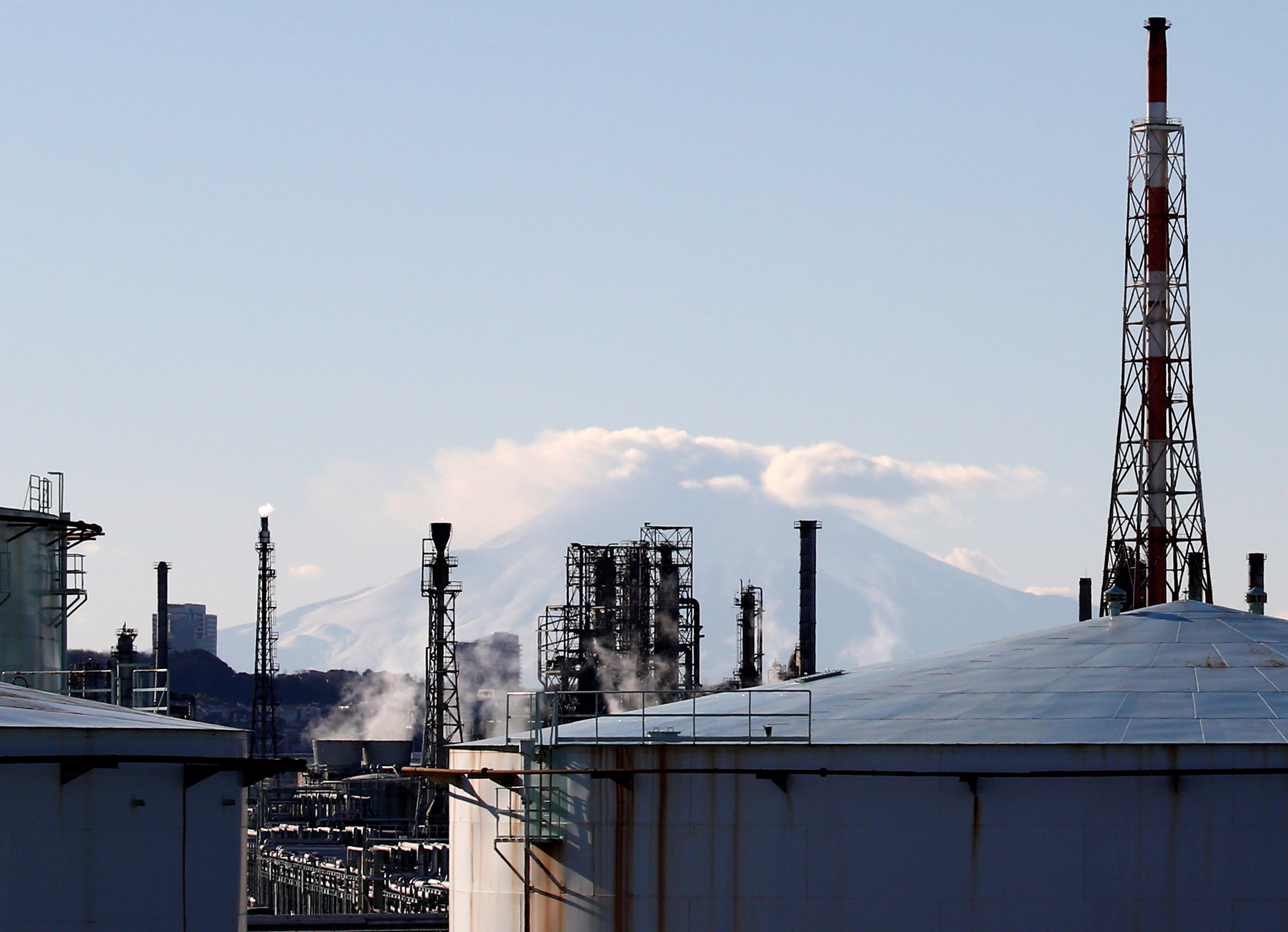 A factory area is seen in front of Mount Fuji in Yokohama, Japan, Jan. 16, 2017.