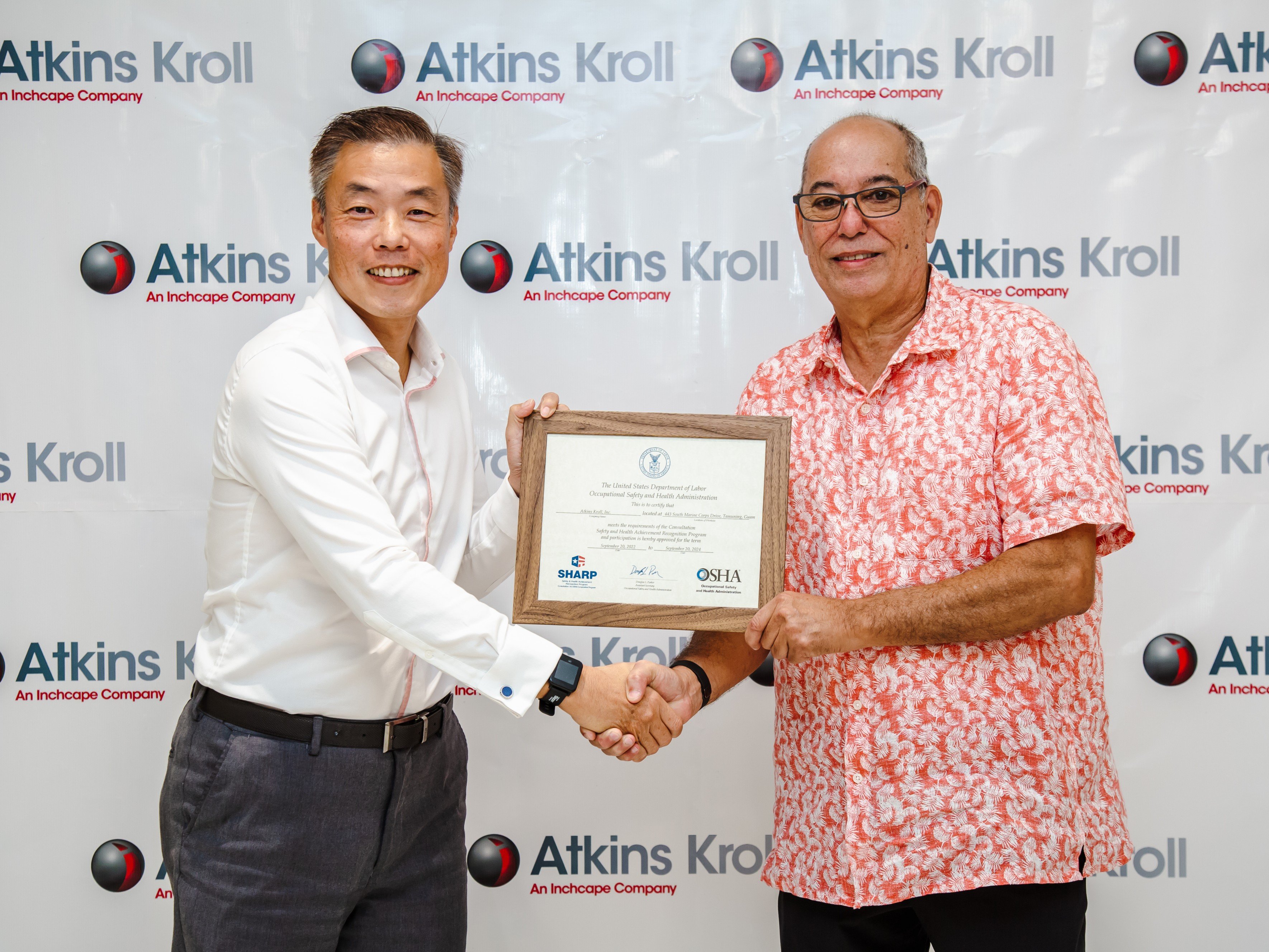 Atkins Kroll President Alex Yap is presented with OSHA SHARP Certification by Guam Department of Labor Director David Dell’Isola during a presentation in the Atkins Kroll Toyota Showroom on Tuesday, Oct. 18. Atkins Kroll is the first company in Guam to receive SHARP certification. AK Guam is exempt from OSHA programmed inspections for two years.