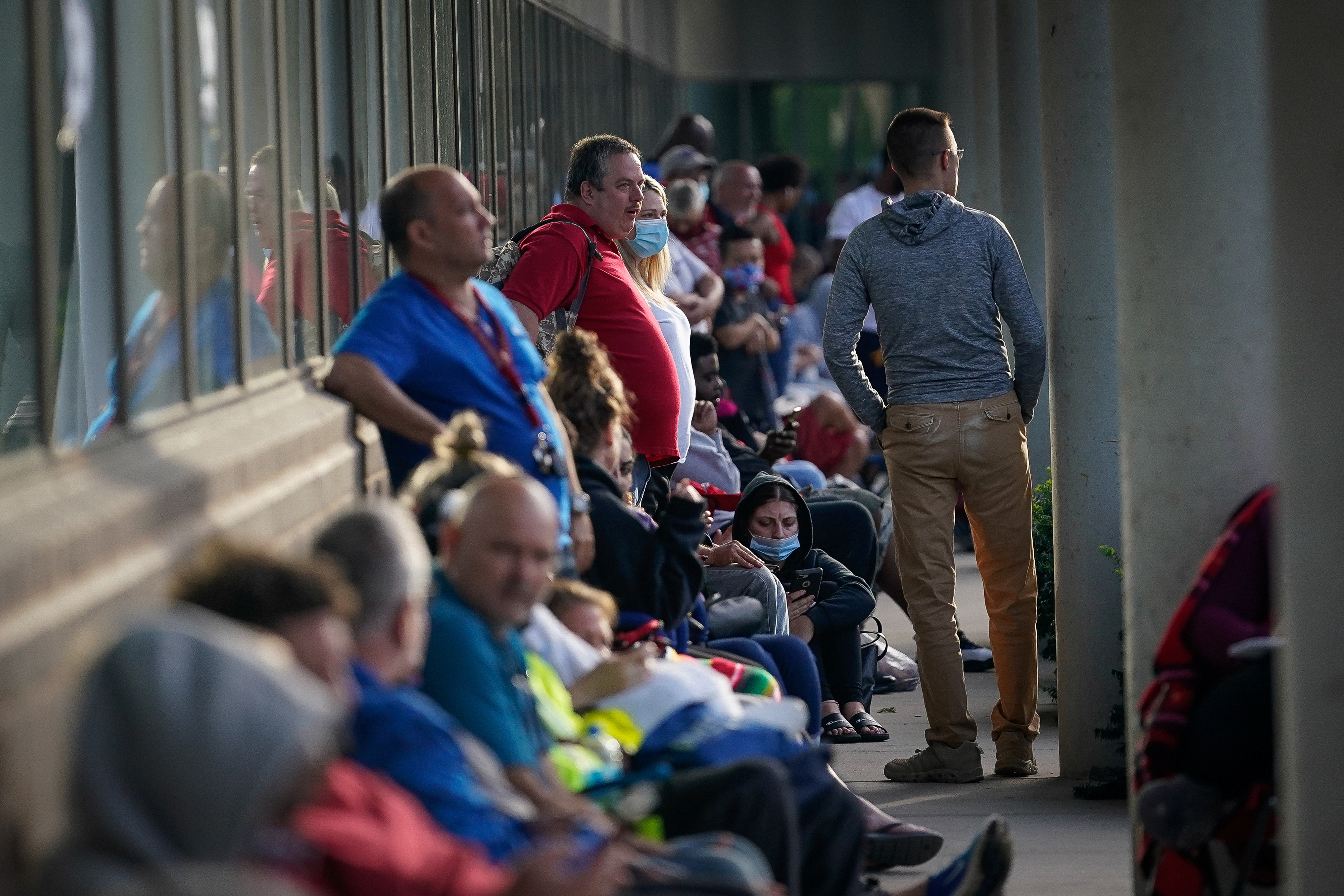 People line up outside Kentucky Career Center prior to its opening to find assistance with their unemployment claims in Frankfort, Kentucky, June 18, 2020.