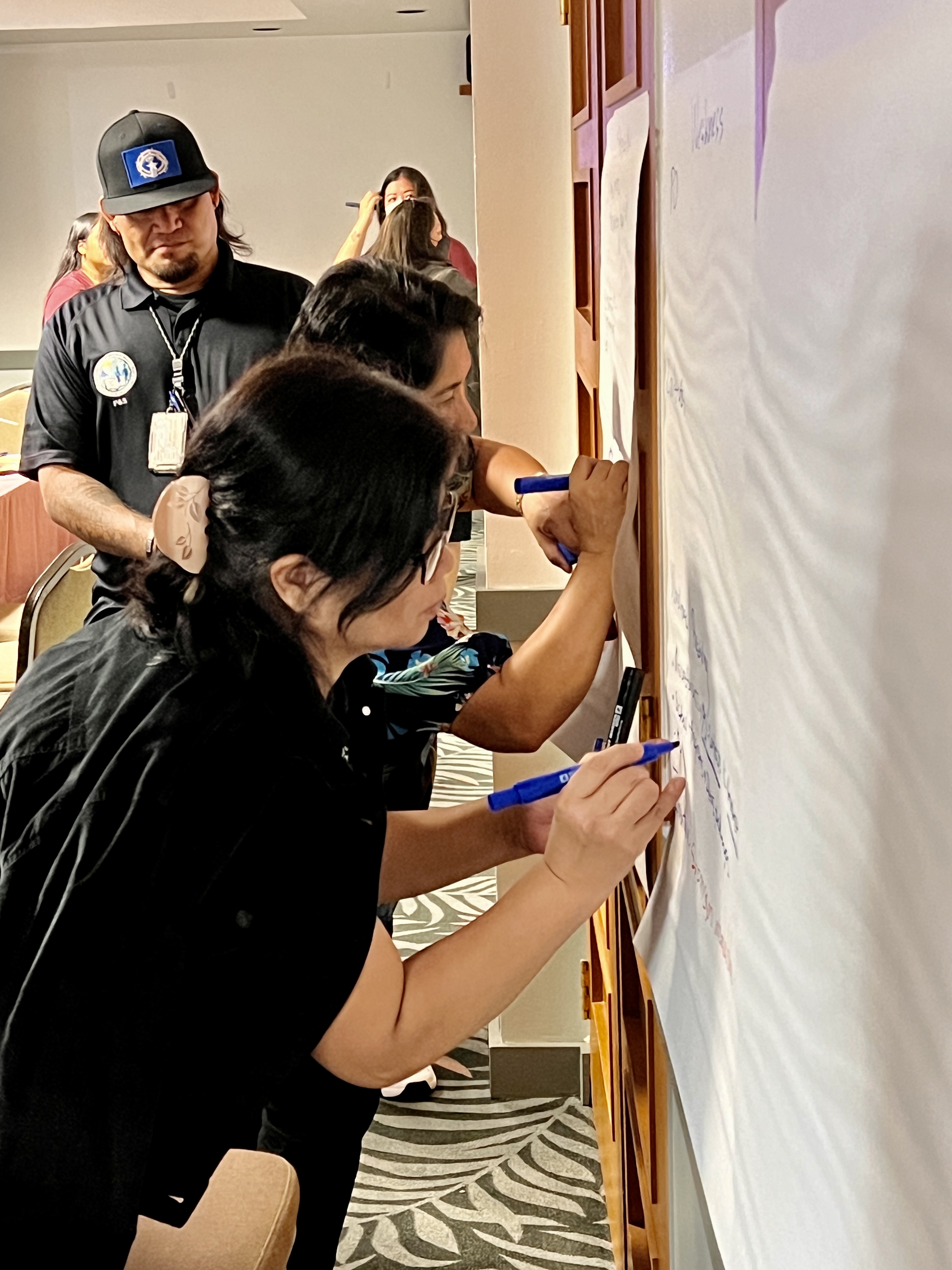 Finance and Budget as well as Procurement and Supply personnel identify their strengths and weaknesses in a team-building activity.