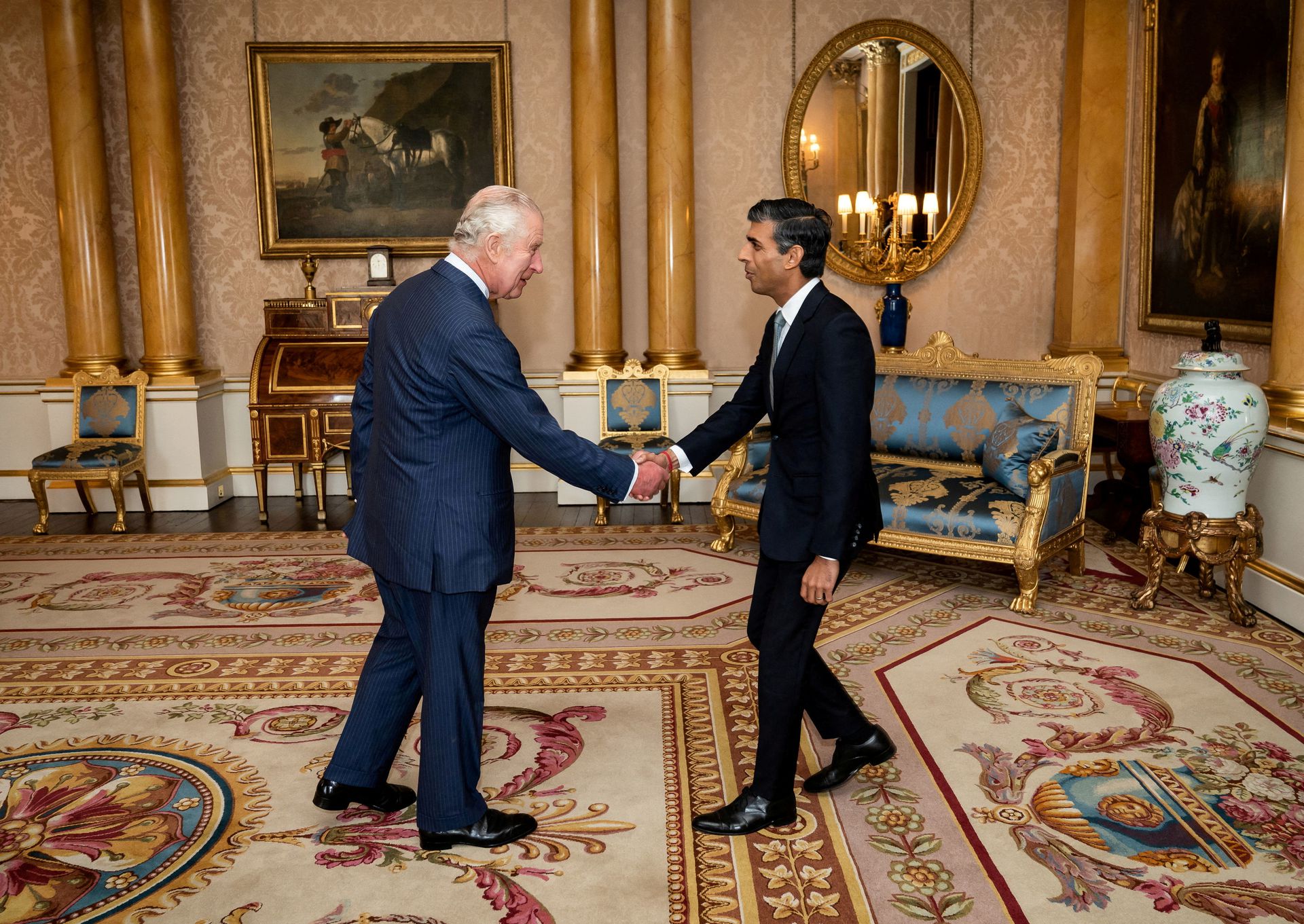 King Charles III welcomes Rishi Sunak during an audience at Buckingham Palace, London, where the monarch invited the newly elected leader of the Conservative Party to become prime minister and form a new government on Tuesday, Oct. 25, 2022.