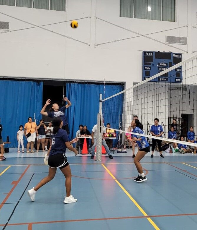 GCA's Hye Jin Elliott rises for the spike during the championship match against SIS on Saturday at the MHS gym.