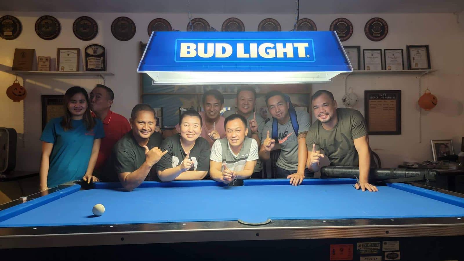 The Ideal Signs JC Rustlers pose for a photo after winning the Tuesday Division title of the SBA Budweiser Open 8-Ball League on Tuesday at the VFW Bar.