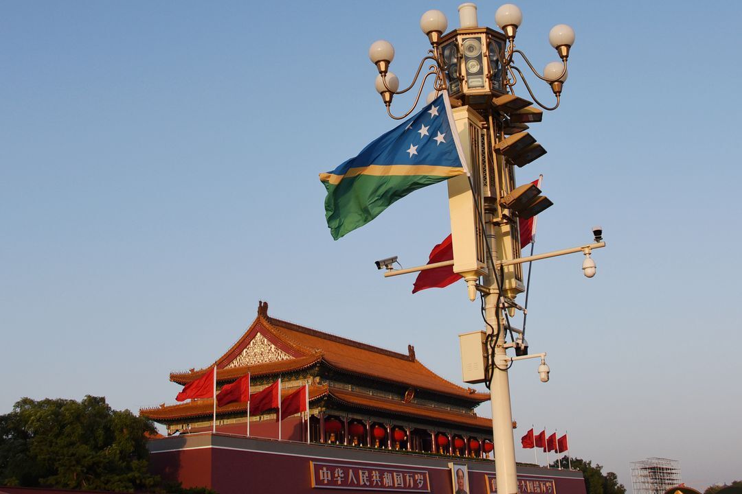 The national flags of Solomon Islands and China flutter at the Tiananmen Square in Beijing, China on Oct. 7, 2019.