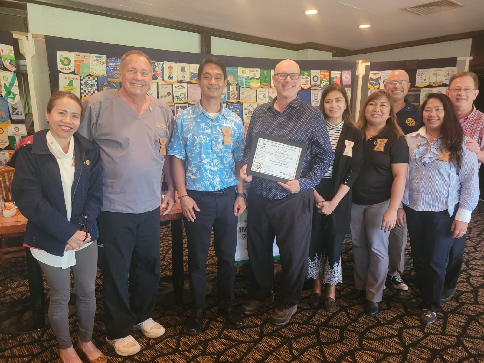 Island Training Solutions President Jim Arenovski, center, poses for a photo with Rotary Club of Saipan President Wendell Posadas, third left, and other Rotarians Tuesday at the Hyatt Regency Saipan's Giovanni’s Restaurant.