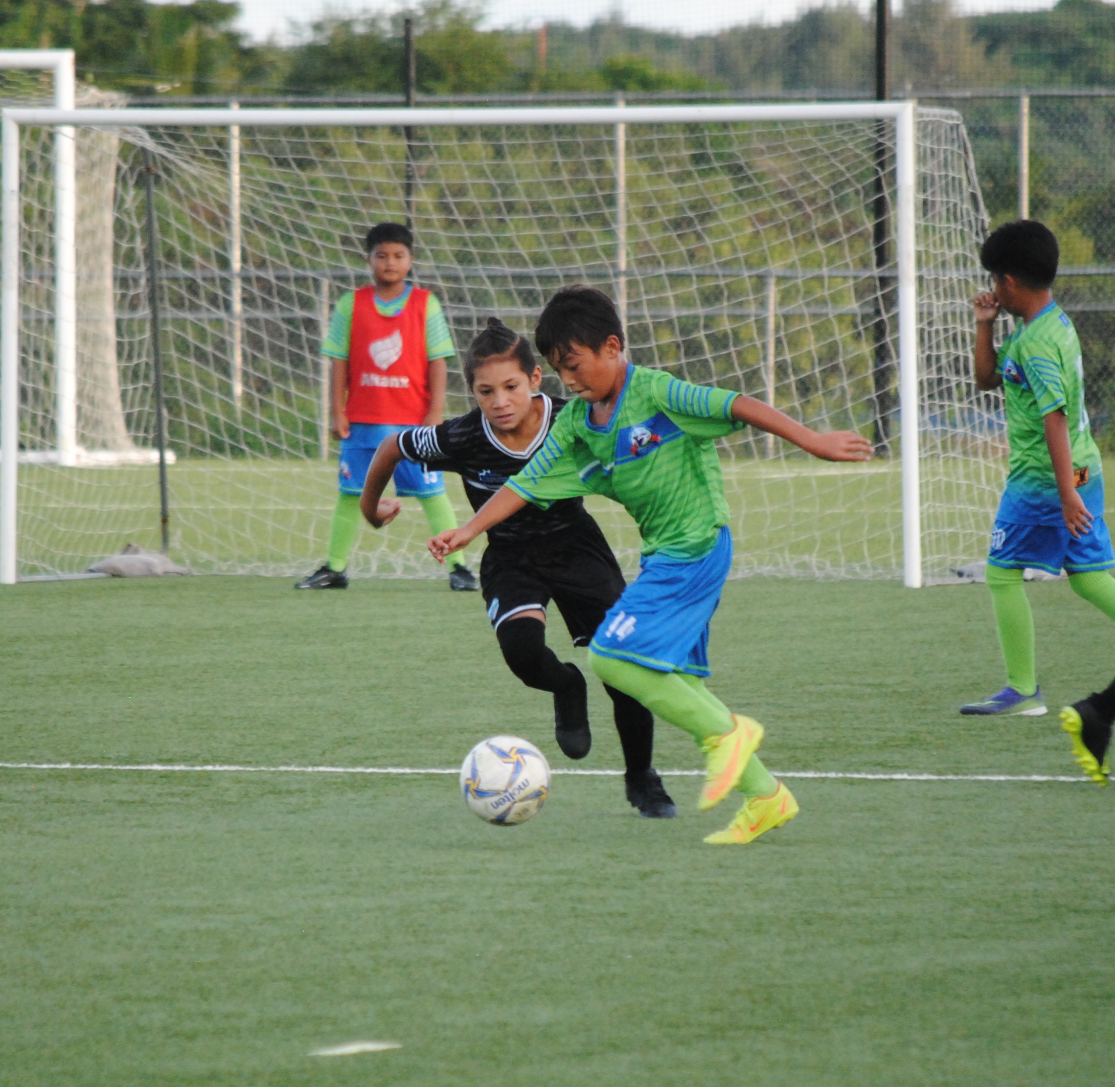 WSR 2's Joshua Lizama pushes past a defender.