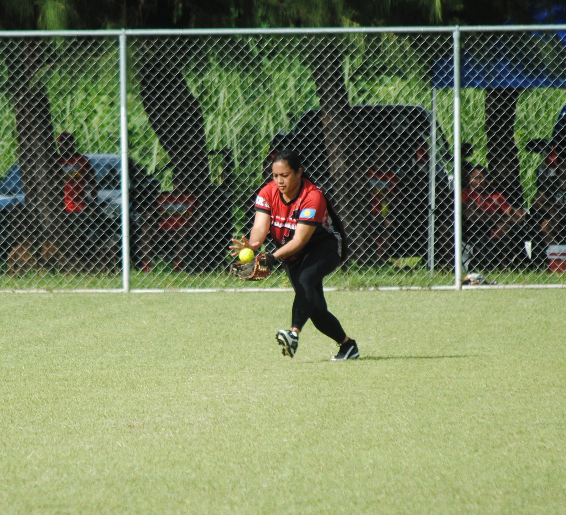 Queens of Diamonds centerfield catches the ball for the out during a 2022 Budweiser Belau Amateur Softball League game Sunday at the Dandan baseball field.