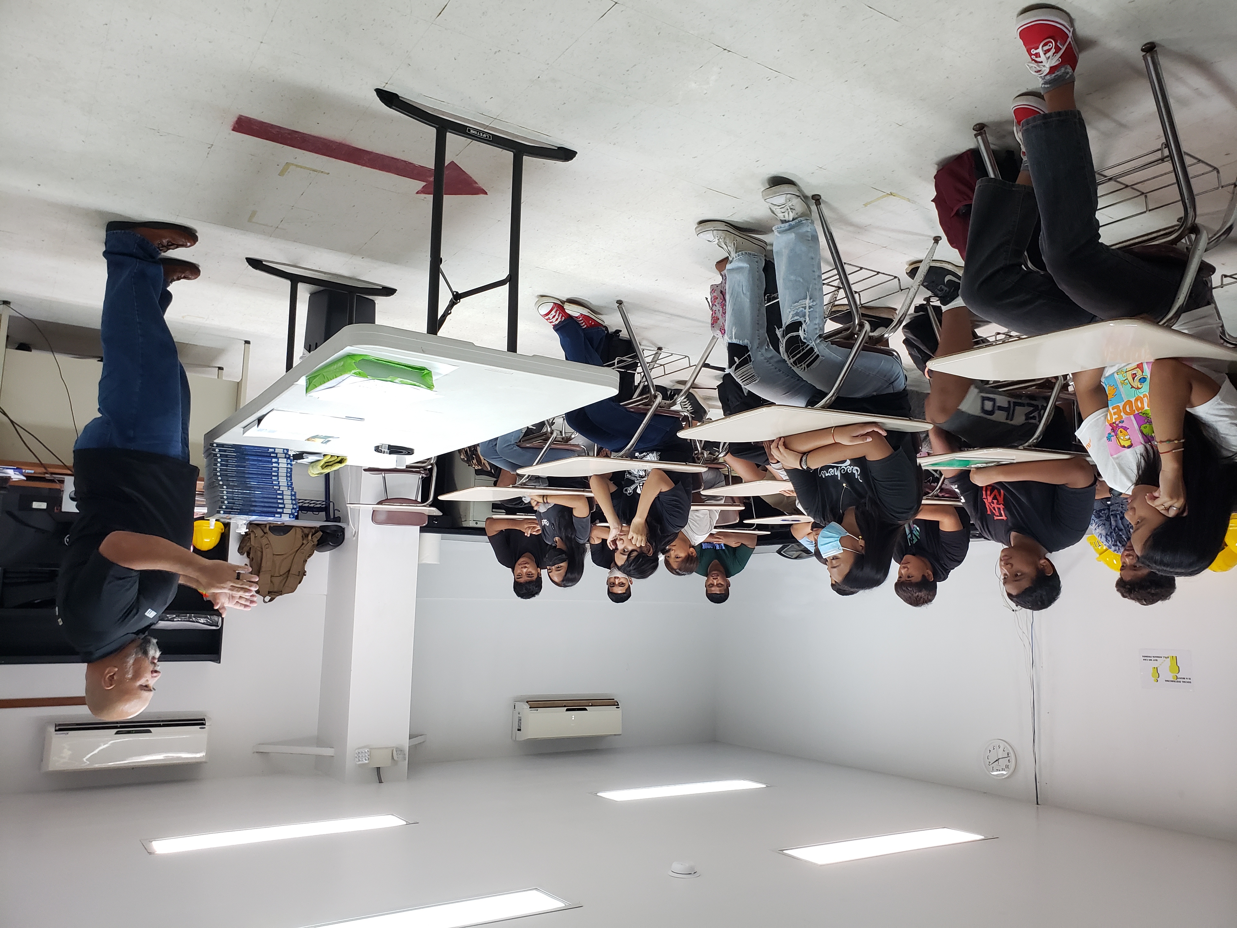 NMTech instructor Luis Deleon Guerrero conducts an elective construction class for  20 Tanapag Middle School students.