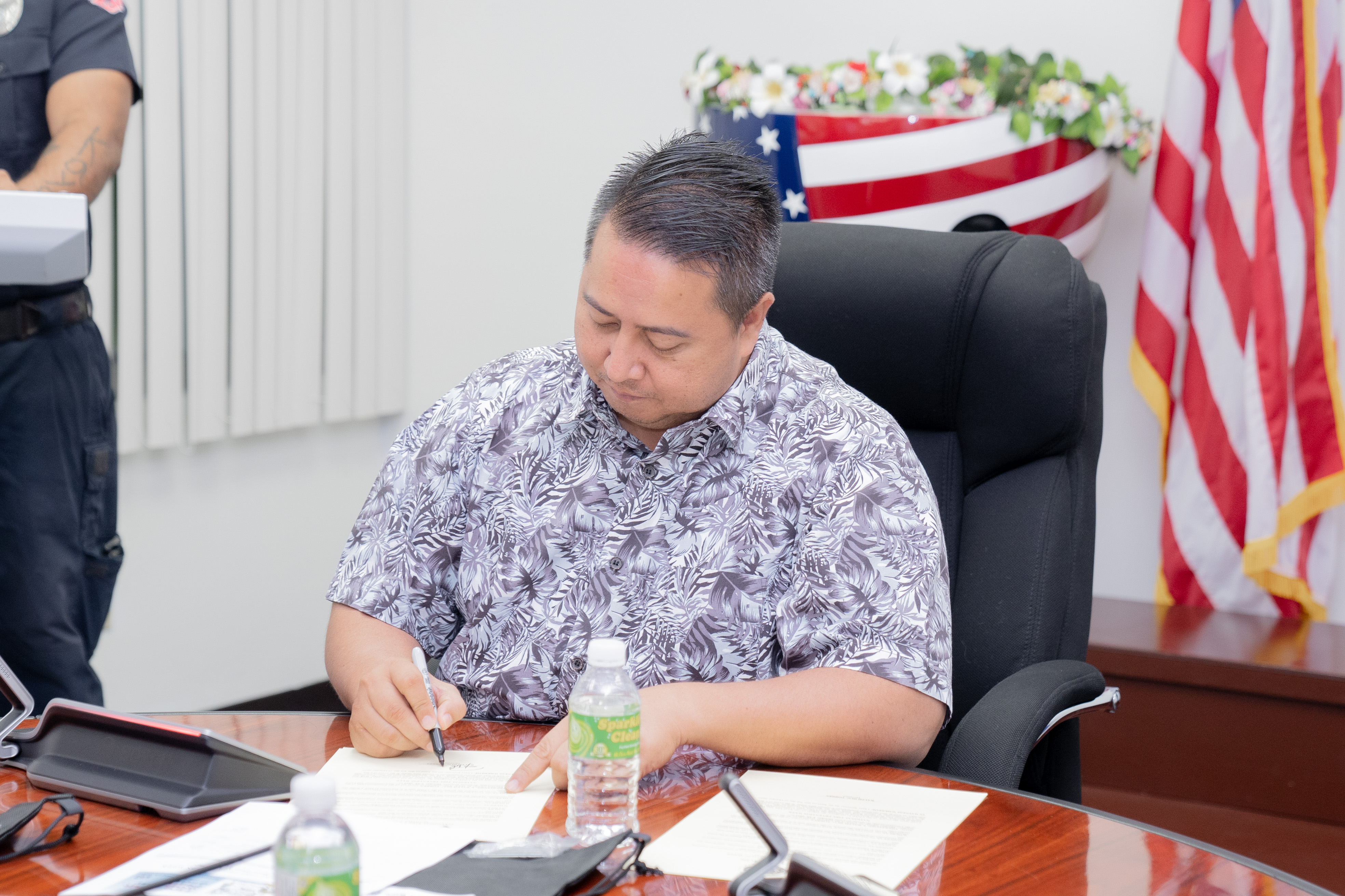 Governor Ralph DLG Torres signs one of the two proclamations for National Fire Prevention Week and National Fallen Firefighters Day on Monday at his office on Capital Hill.