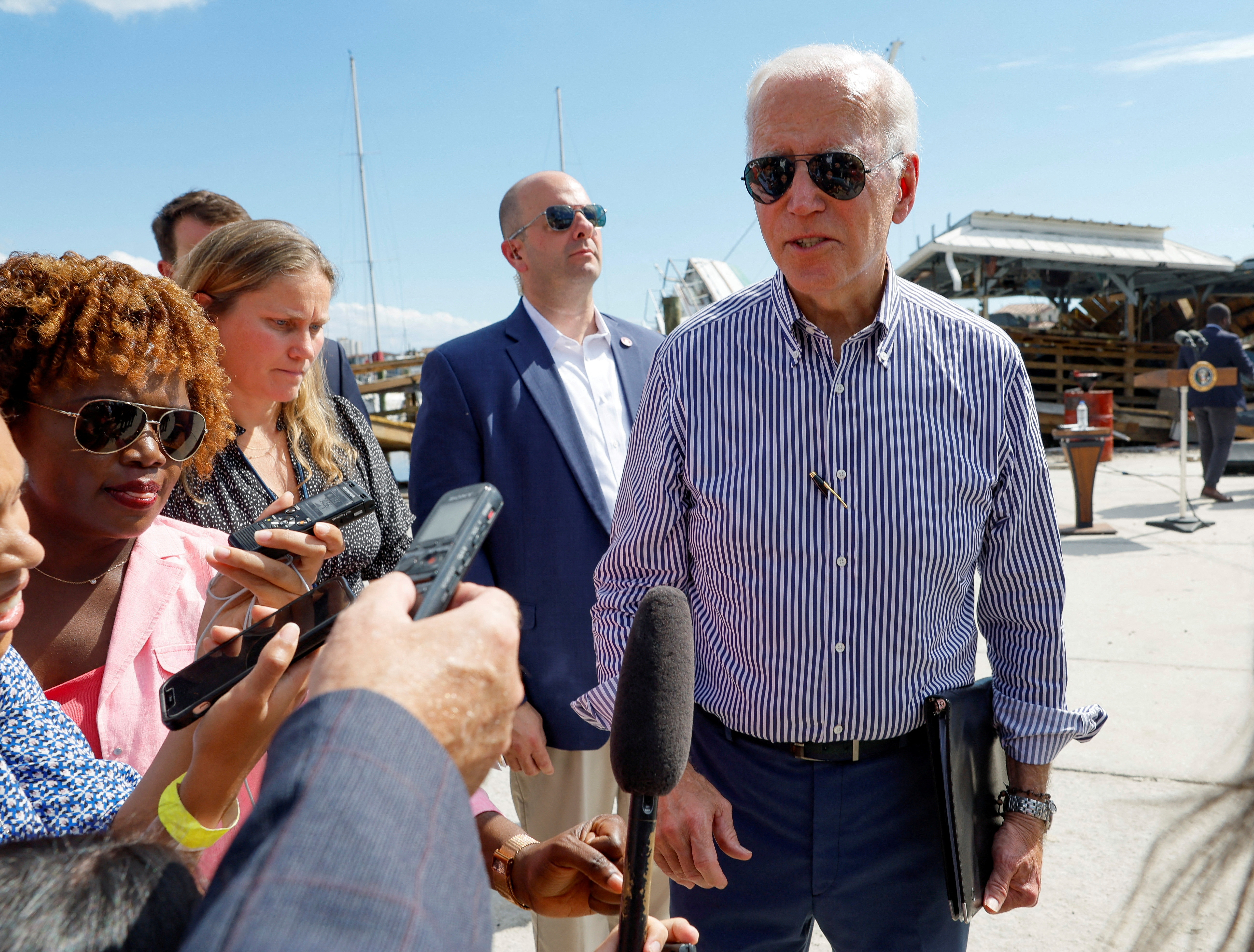 President Joe Biden speaks to media as he tours areas damaged by Hurricane Ian during a visit to Florida, in Fort Myers Beach, Florida, Oct. 5, 2022.