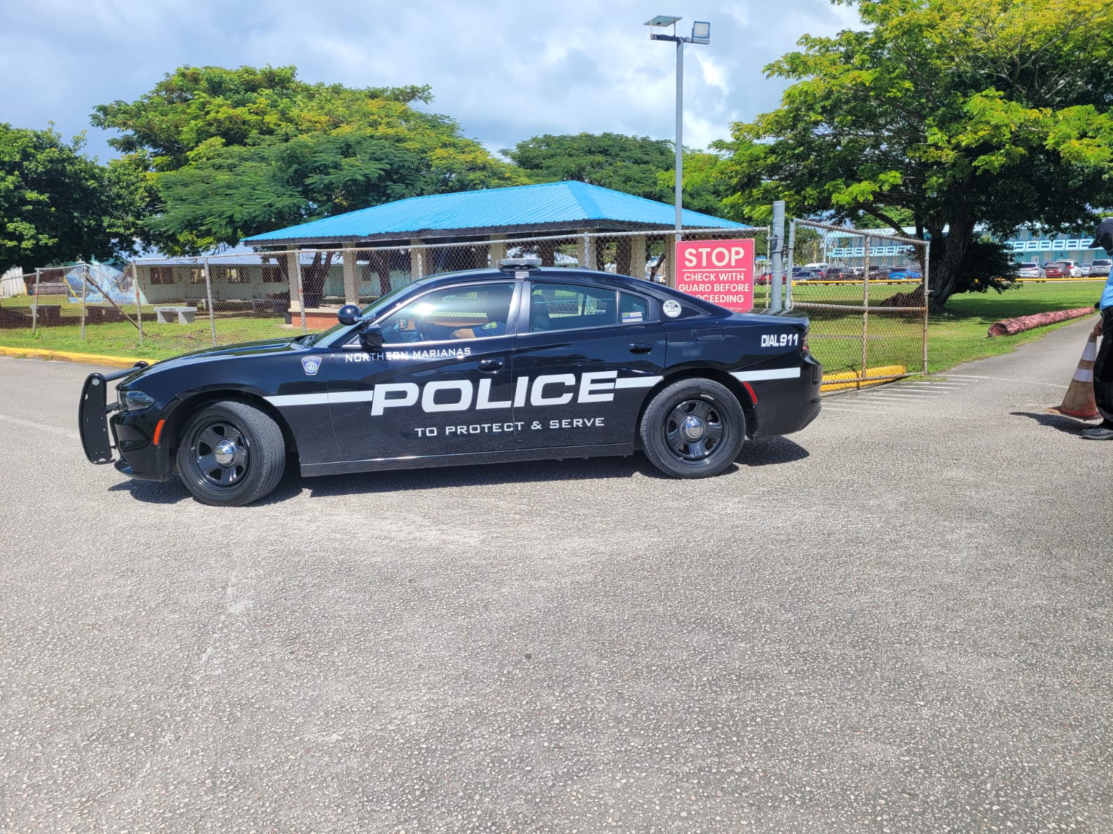 A police officer in his vehicle is seen near the entrance to Marianas High School on Friday morning, Nov. 18, 2022.