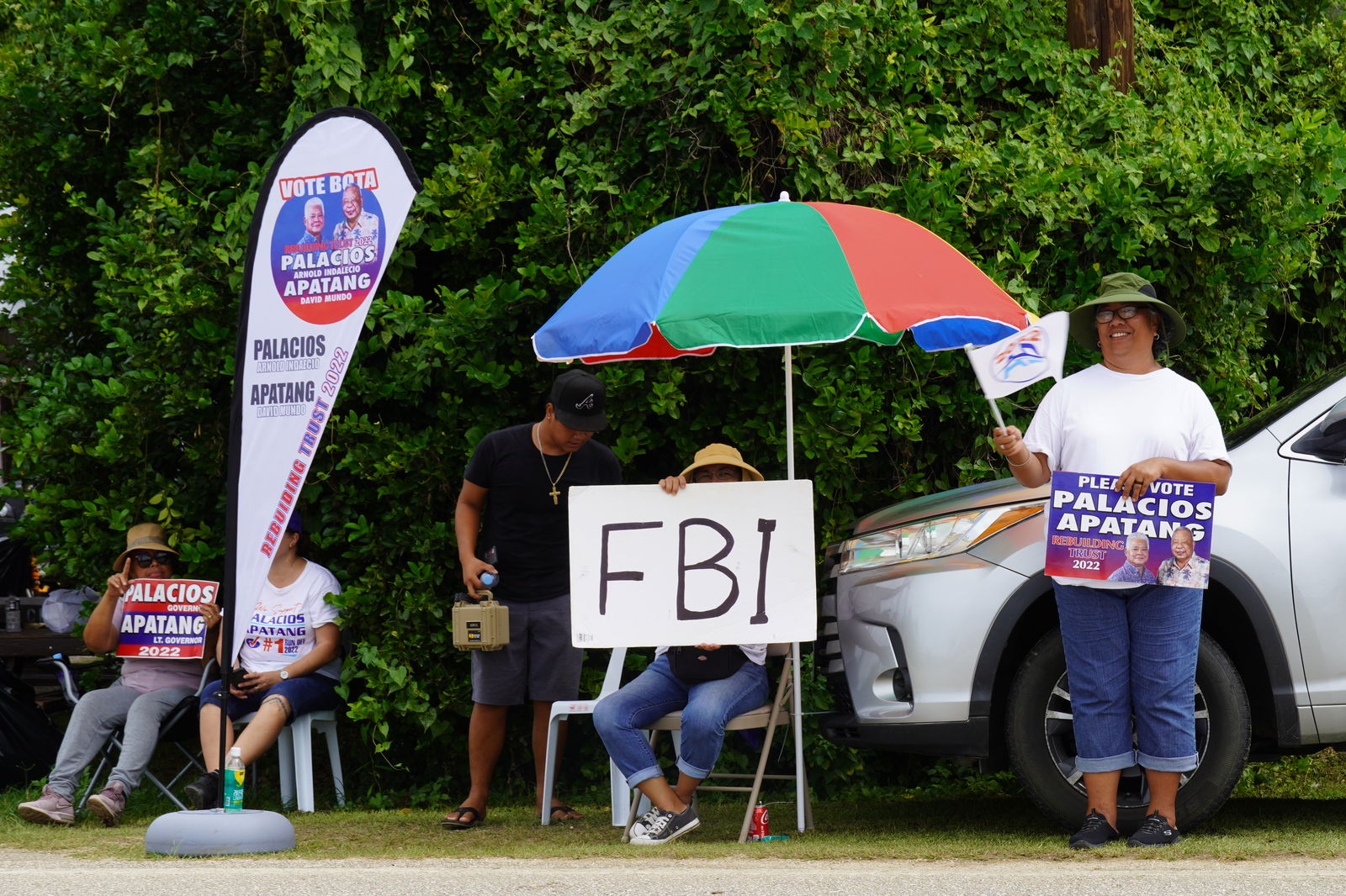 Independent supporters in Dandan display their signs.