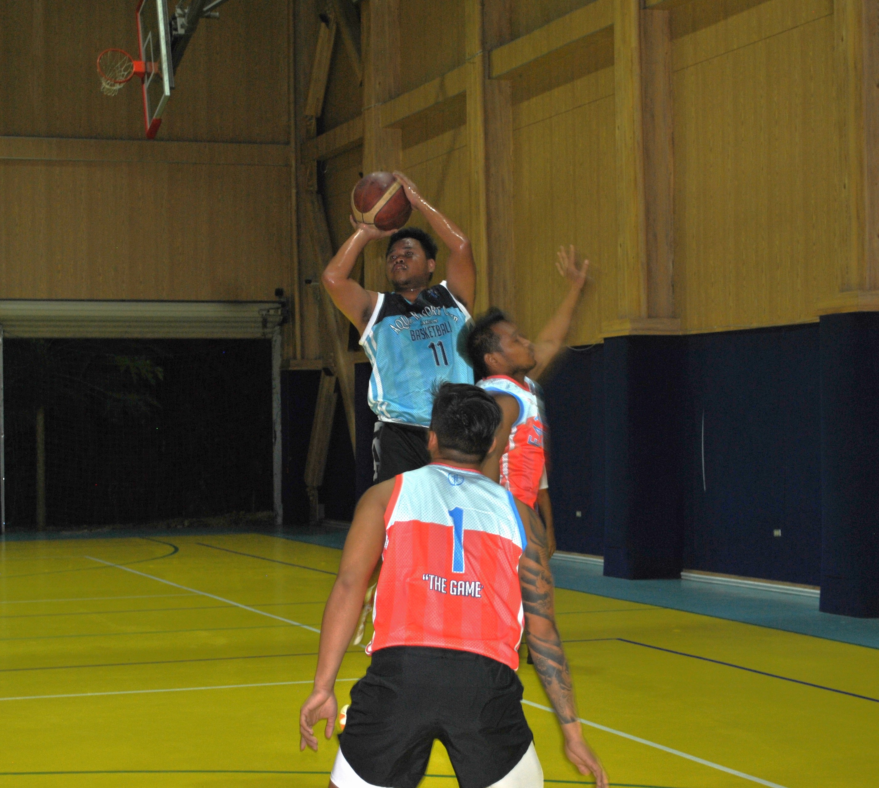 Aqua's Jack Aranda takes the three-point over a defender during an MIBL Fantasy Draft game Friday at the ACS gym.  