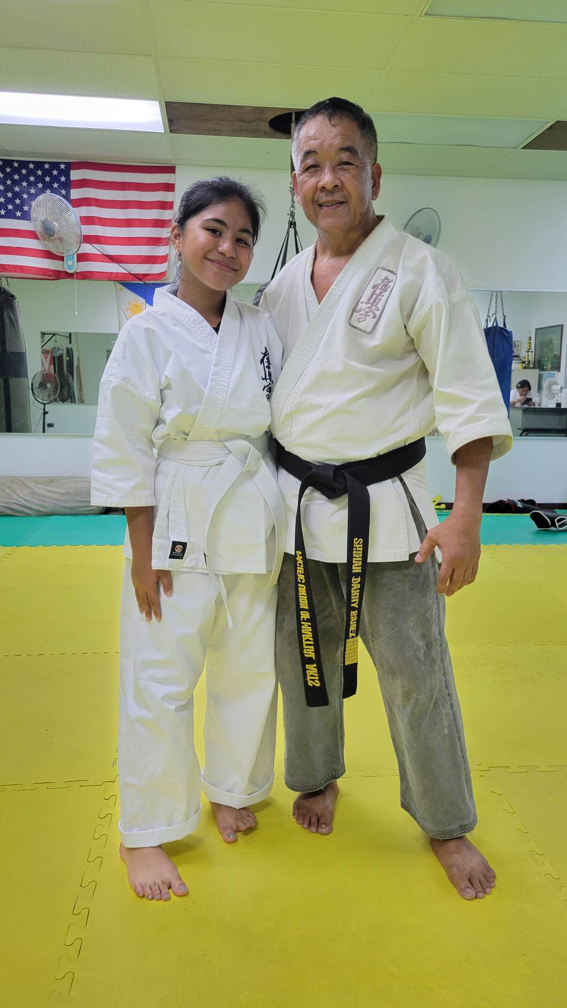 Maja Diaz poses for a photo with Sensei Danny Banez after a Kyokushin Karate training session.